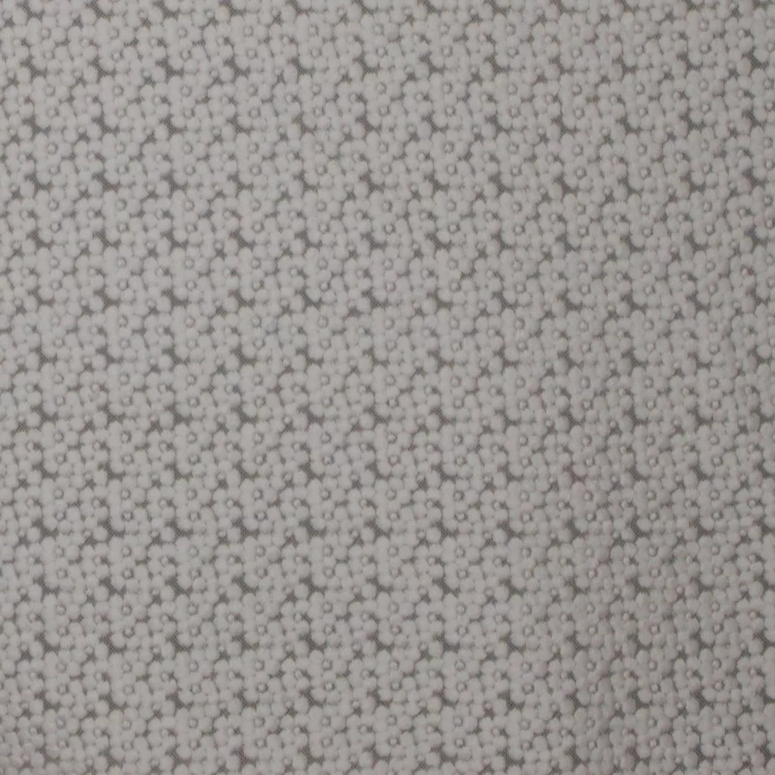 Kant met geborduurde witte bloemetjes.