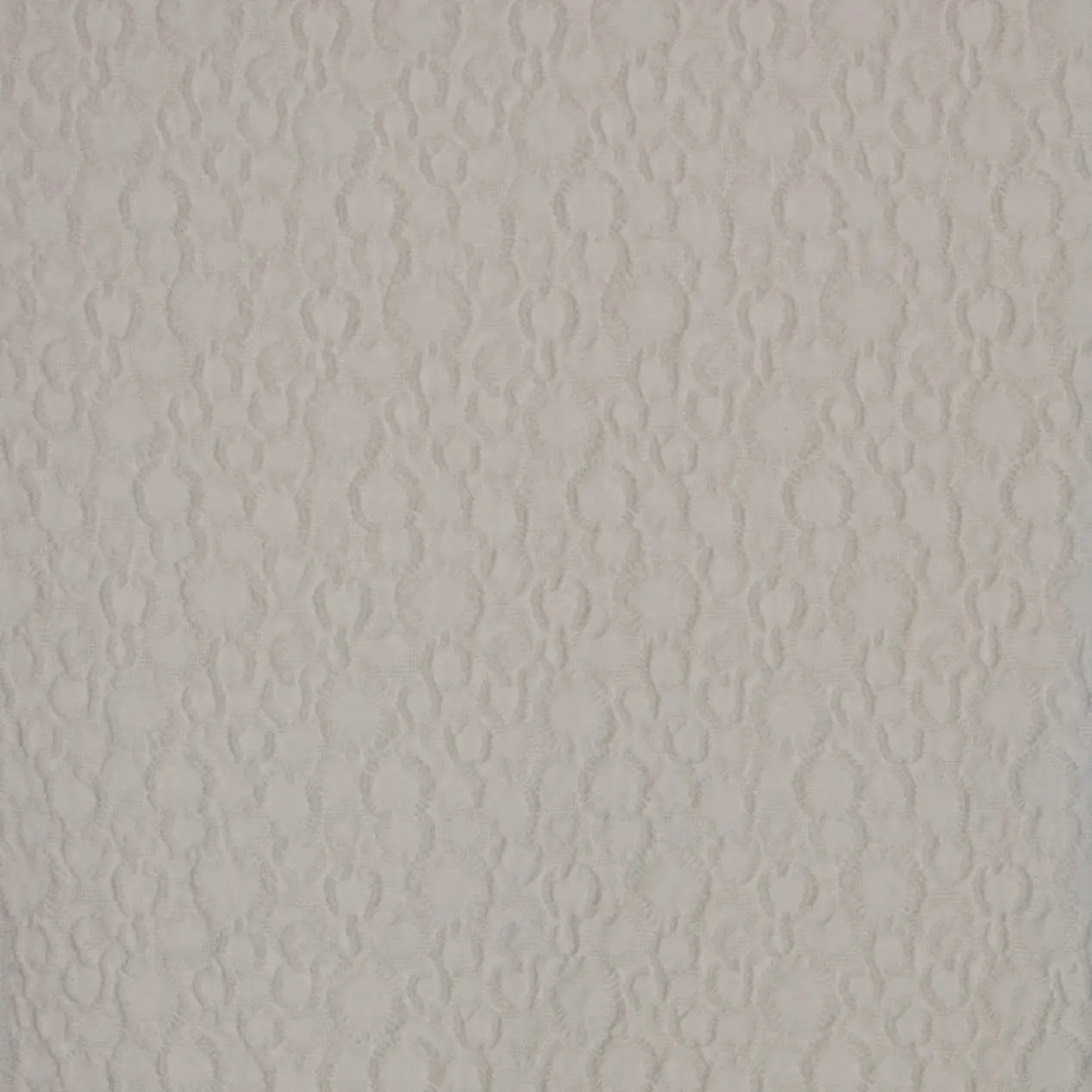 Jacquard ecru met cirkelvormig motief.