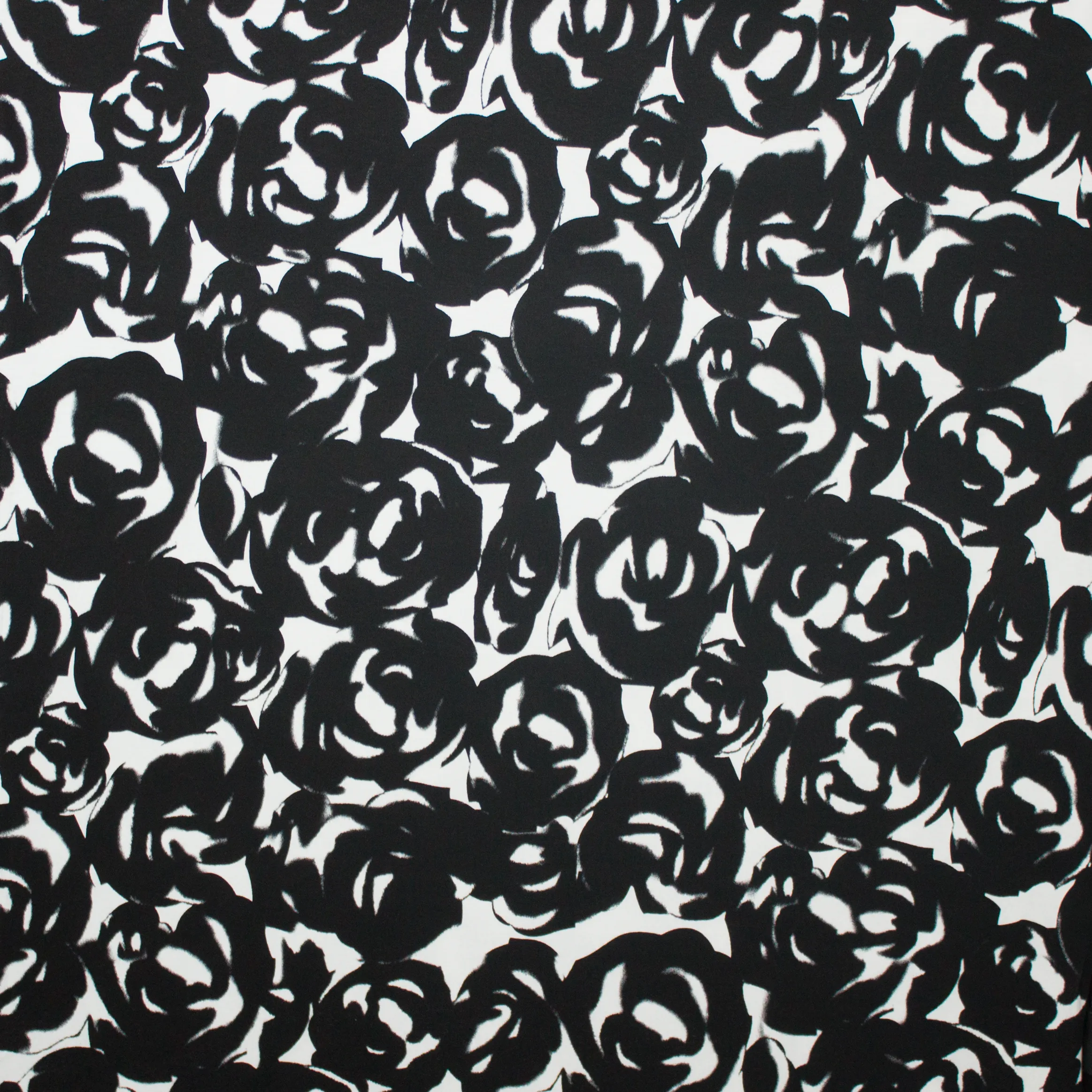 Tricot met abstract bloemmotief