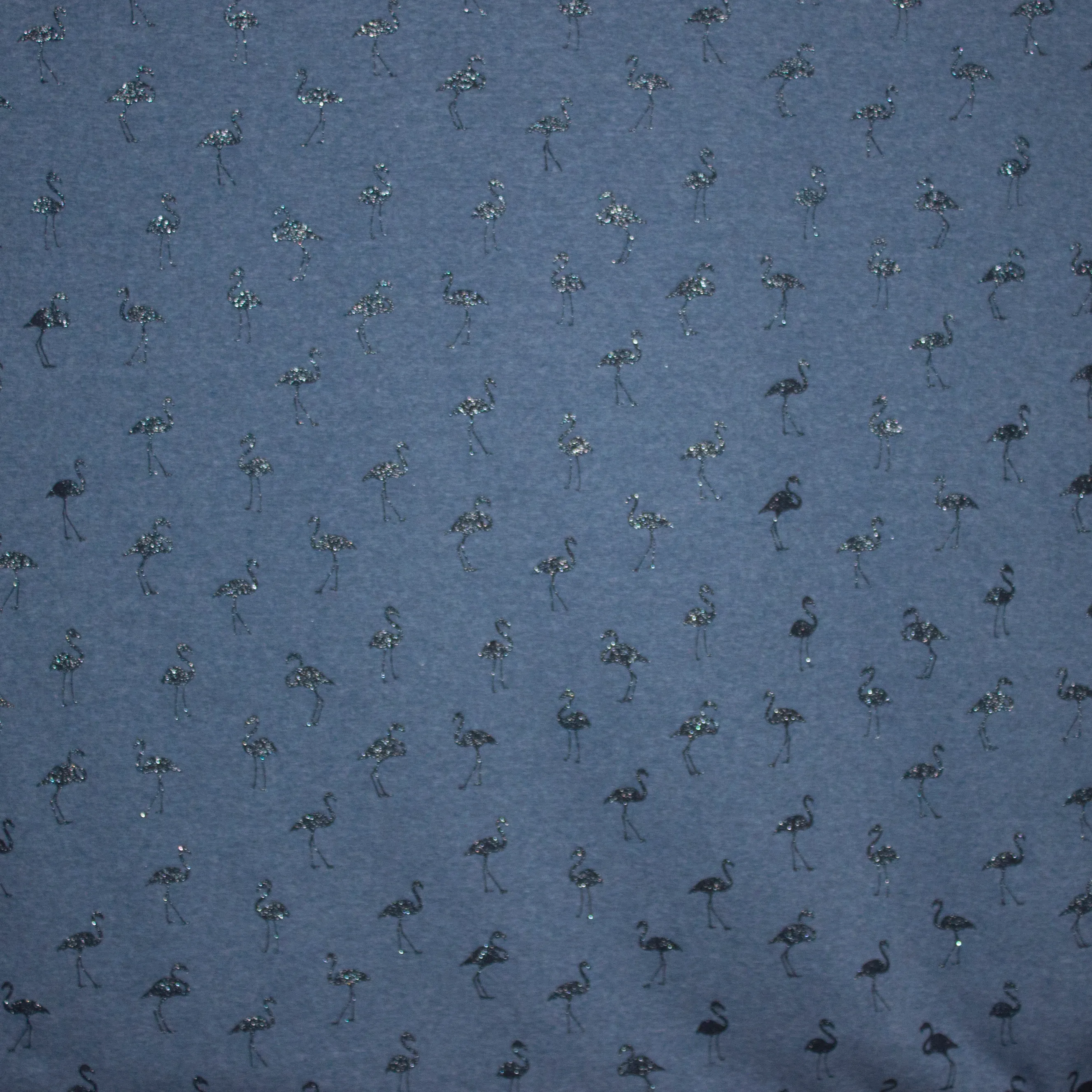 sweaterstof in jeansblauw met glitterflamingo