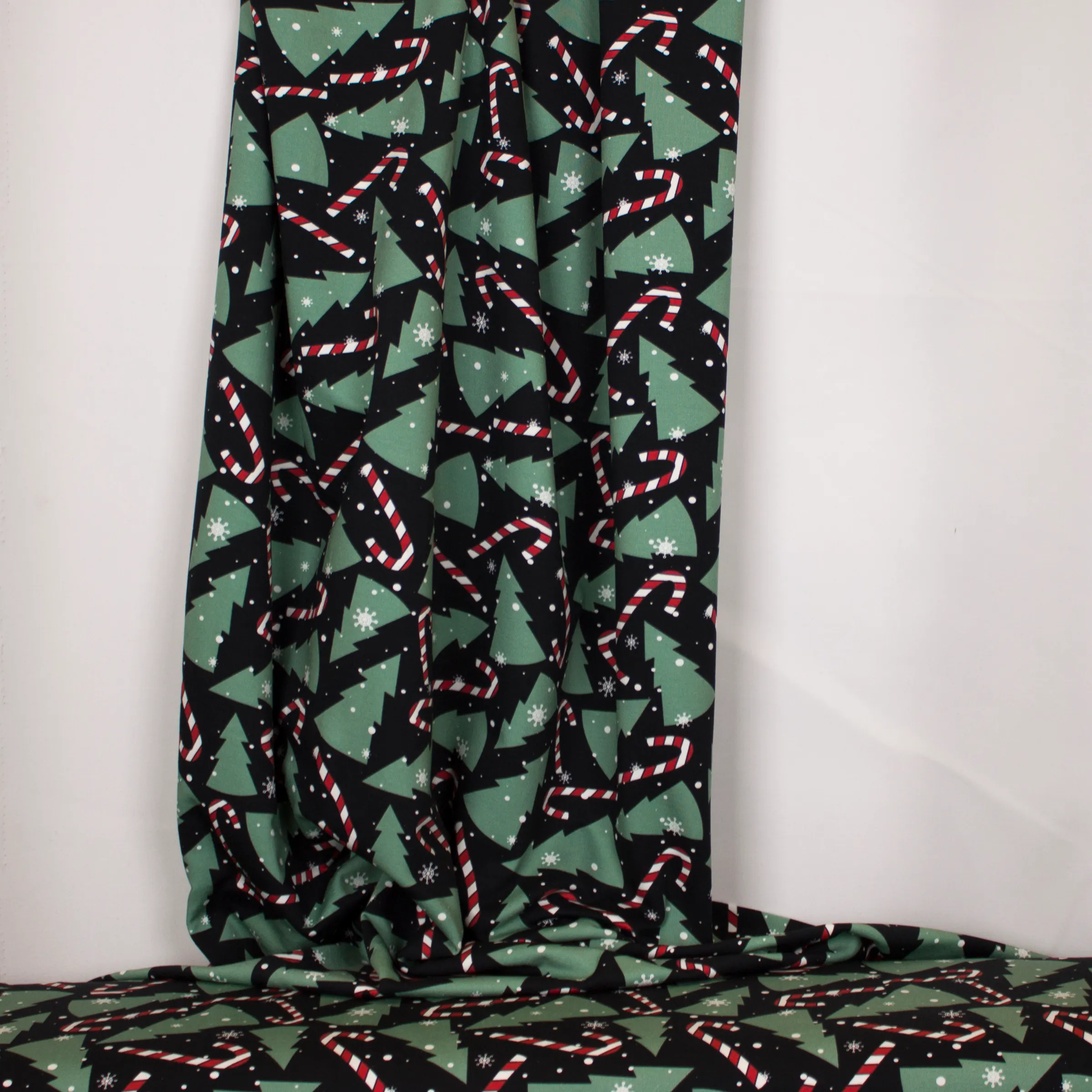 Zwarte french terry met kerstbomen en lolly's
