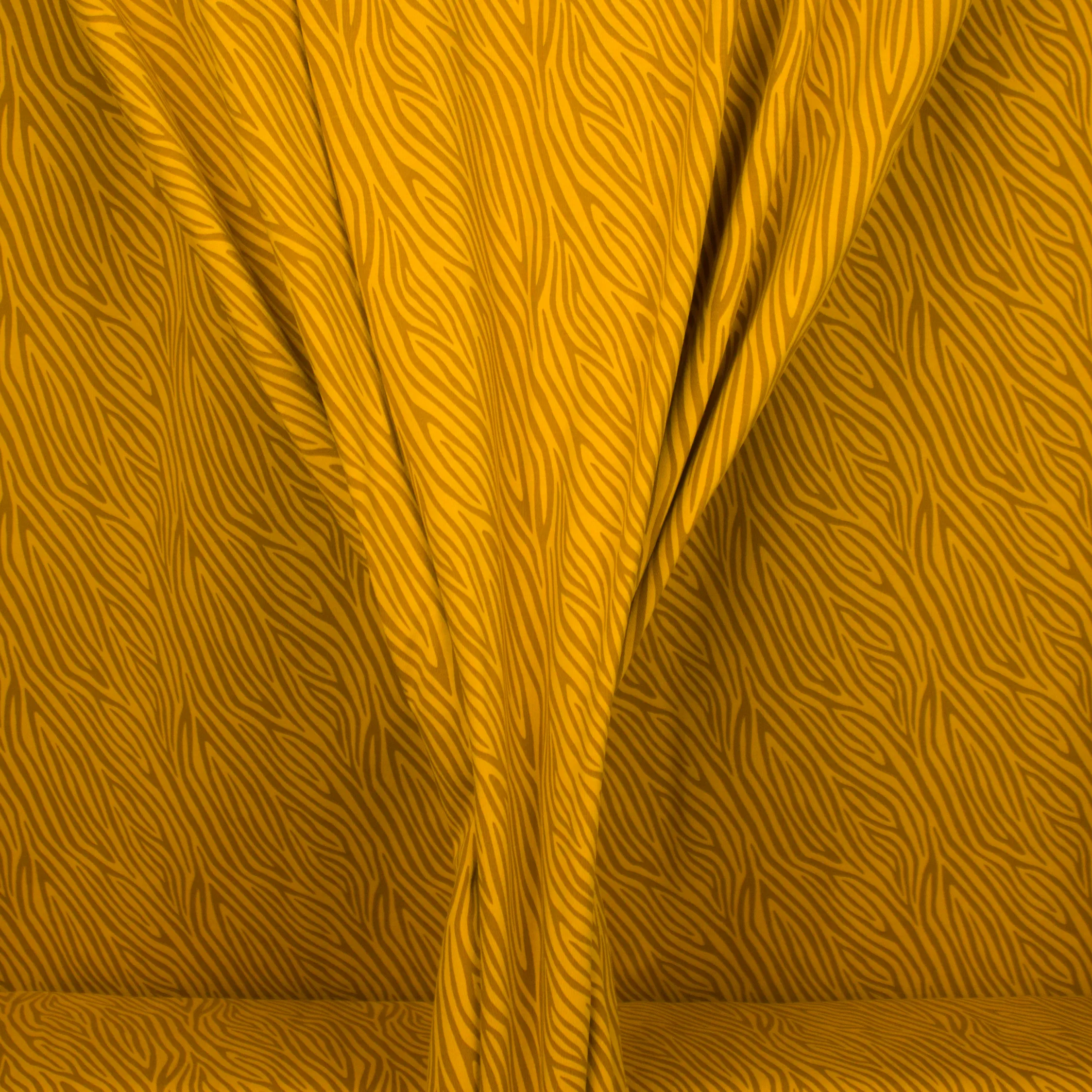 Okergele tricot met abstracte lijnen