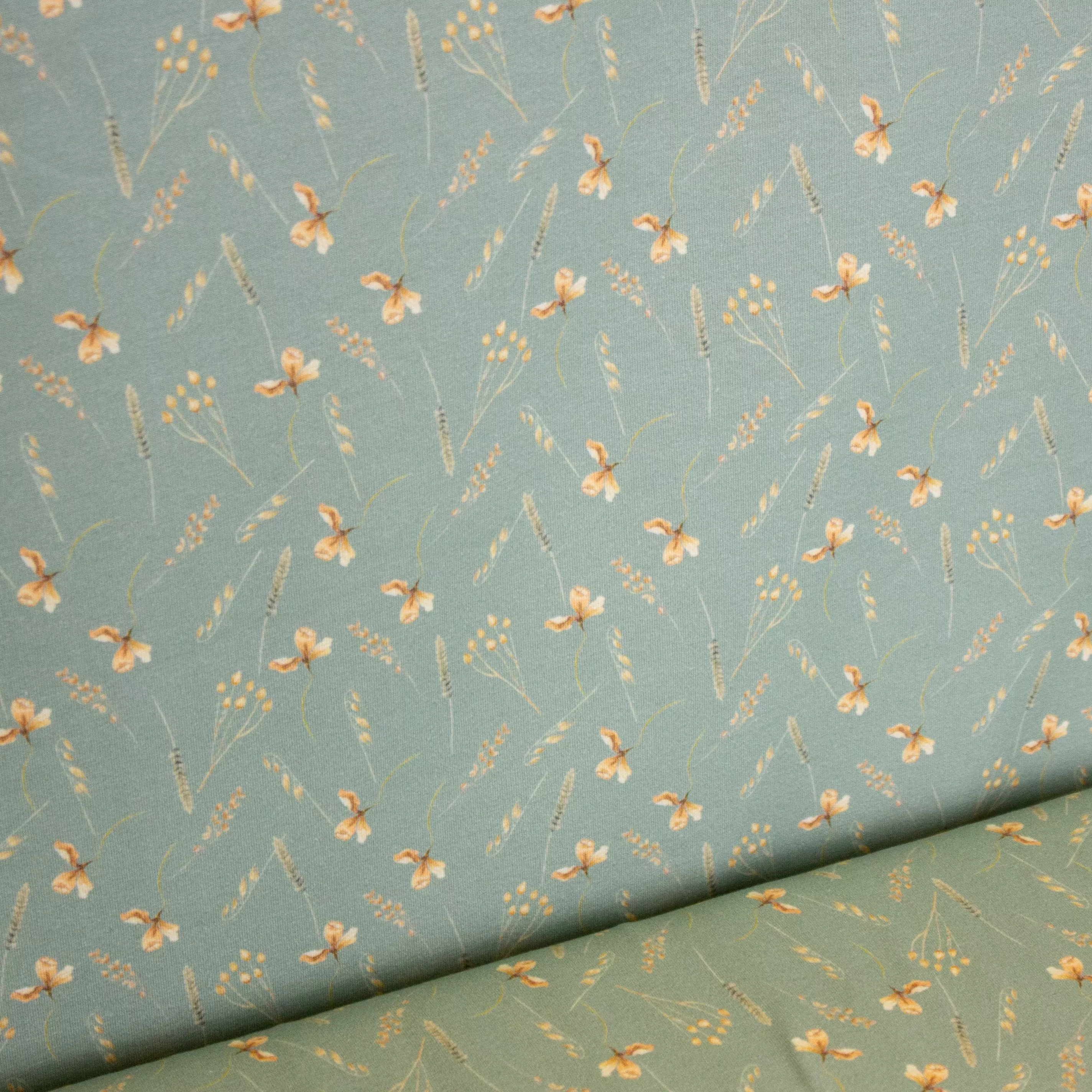 Munt katoen tricot met kleine plantjes