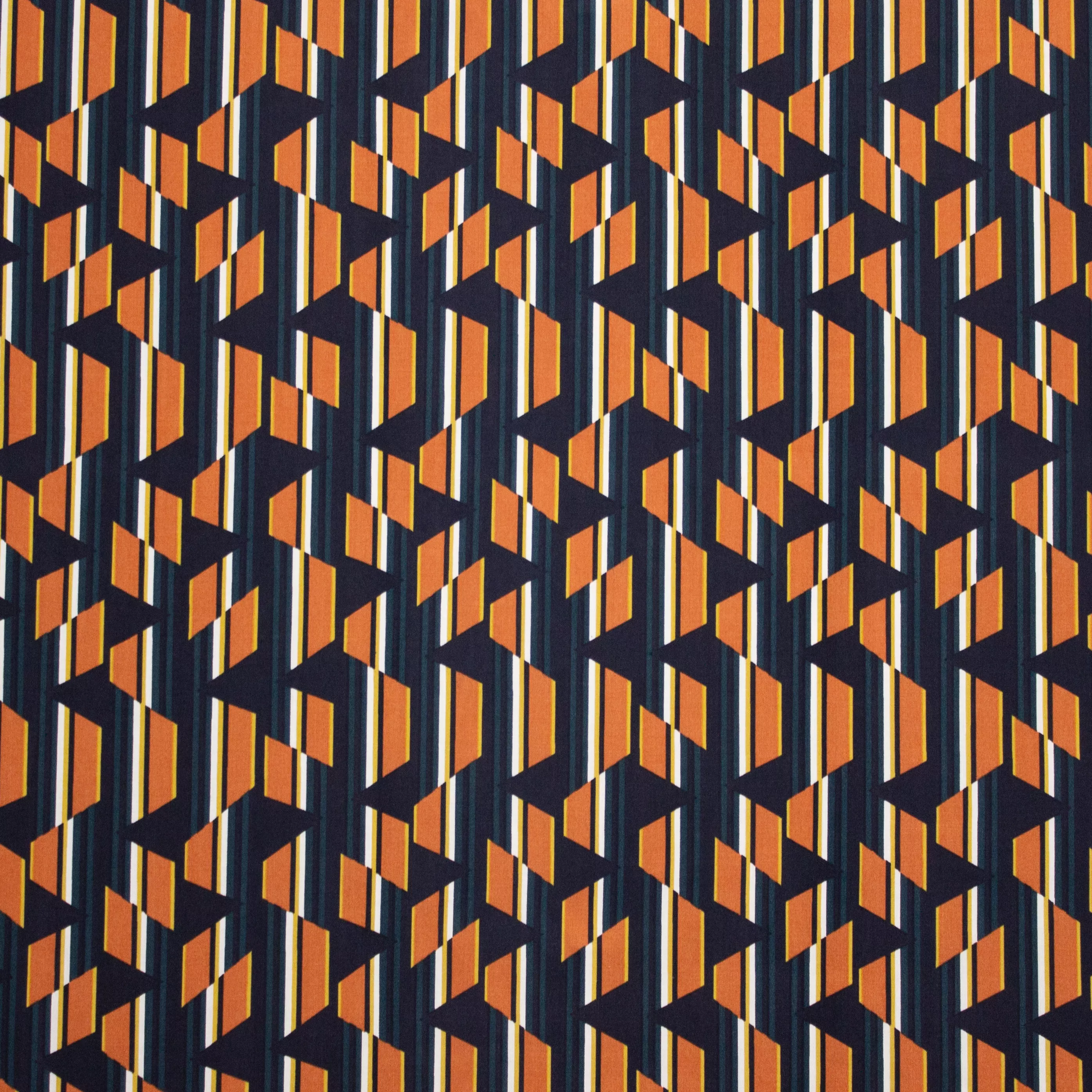 Viscose met blauw / oranje abstract patroon