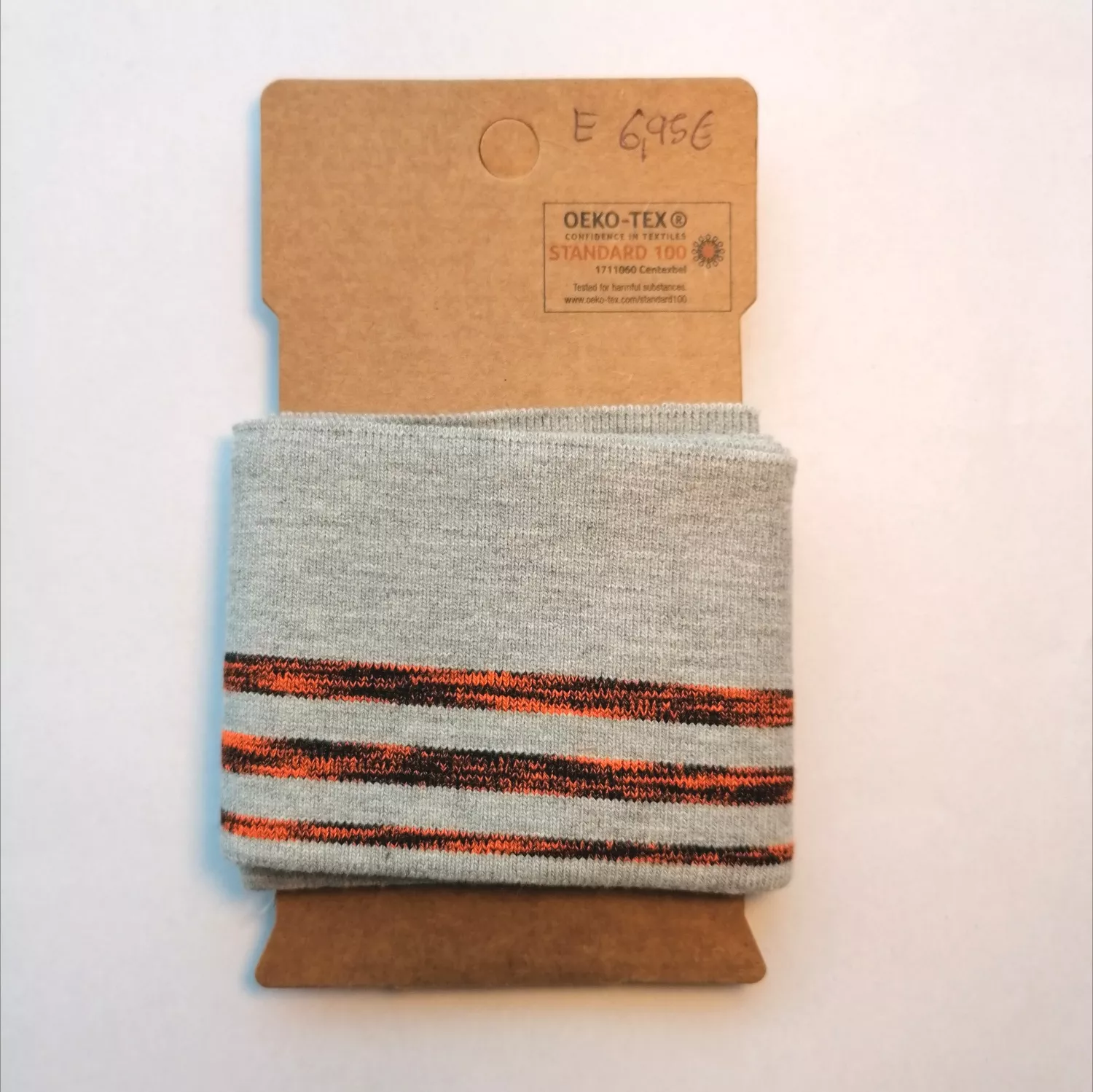 Grijze cuff (boordstof) met fluo oranje/zwarte strepen
