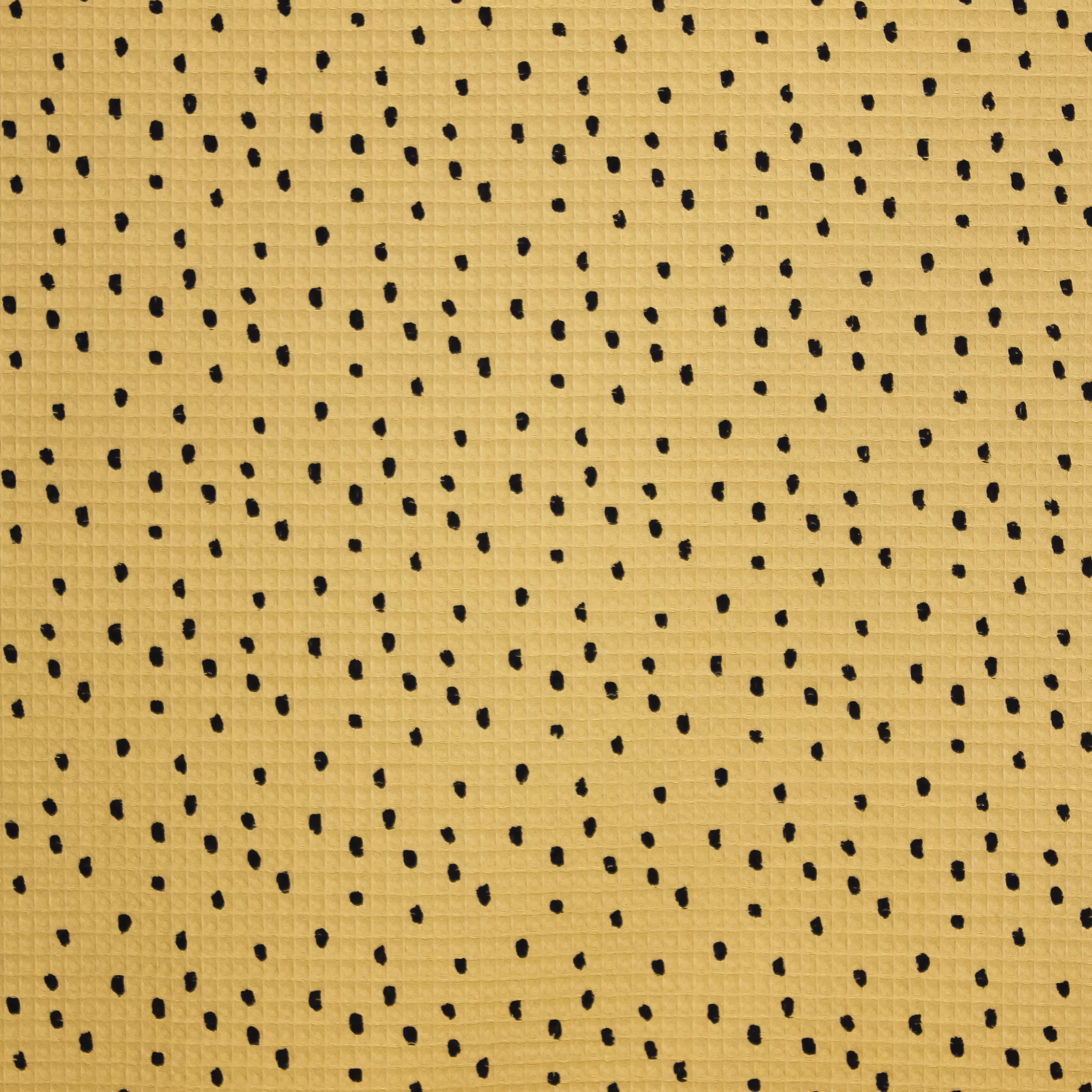 Gele katoenen wafelstof met zwarte stippen