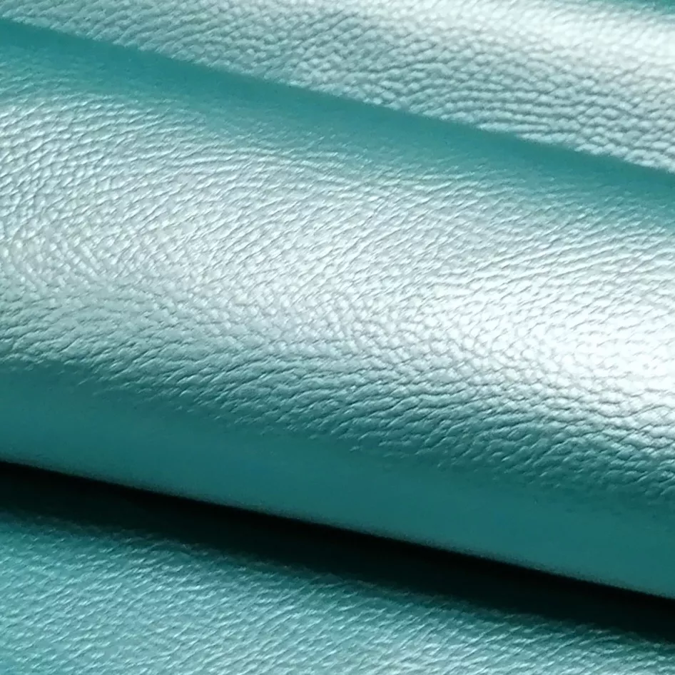 Turquoise glanzend imitatieleer (PU leer) met stoffen achterzijde