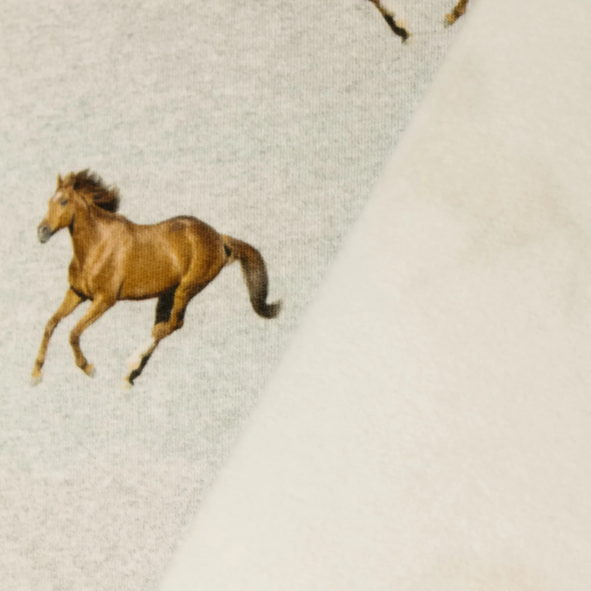 Sweaterstof met paarden en zachte achterkant