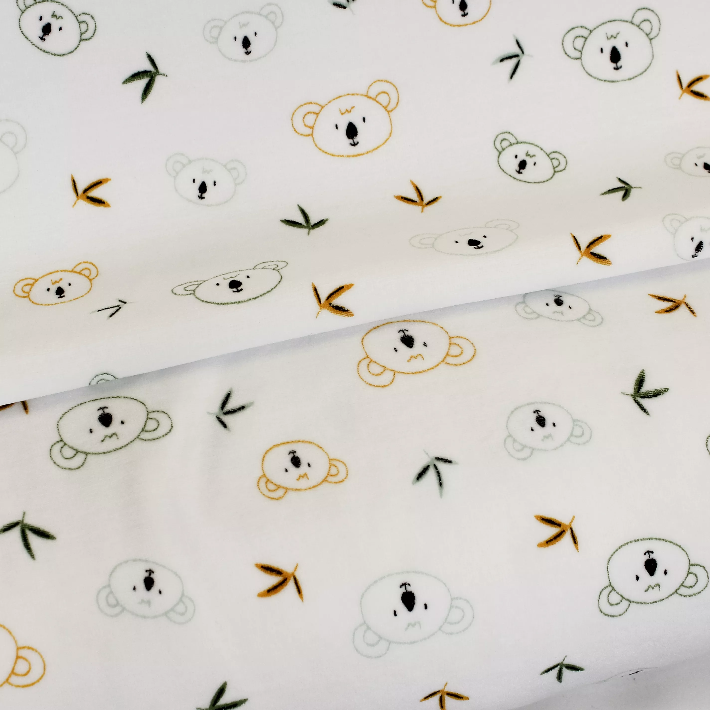 Witte nicky velours met groene en gele koala's - Poppy