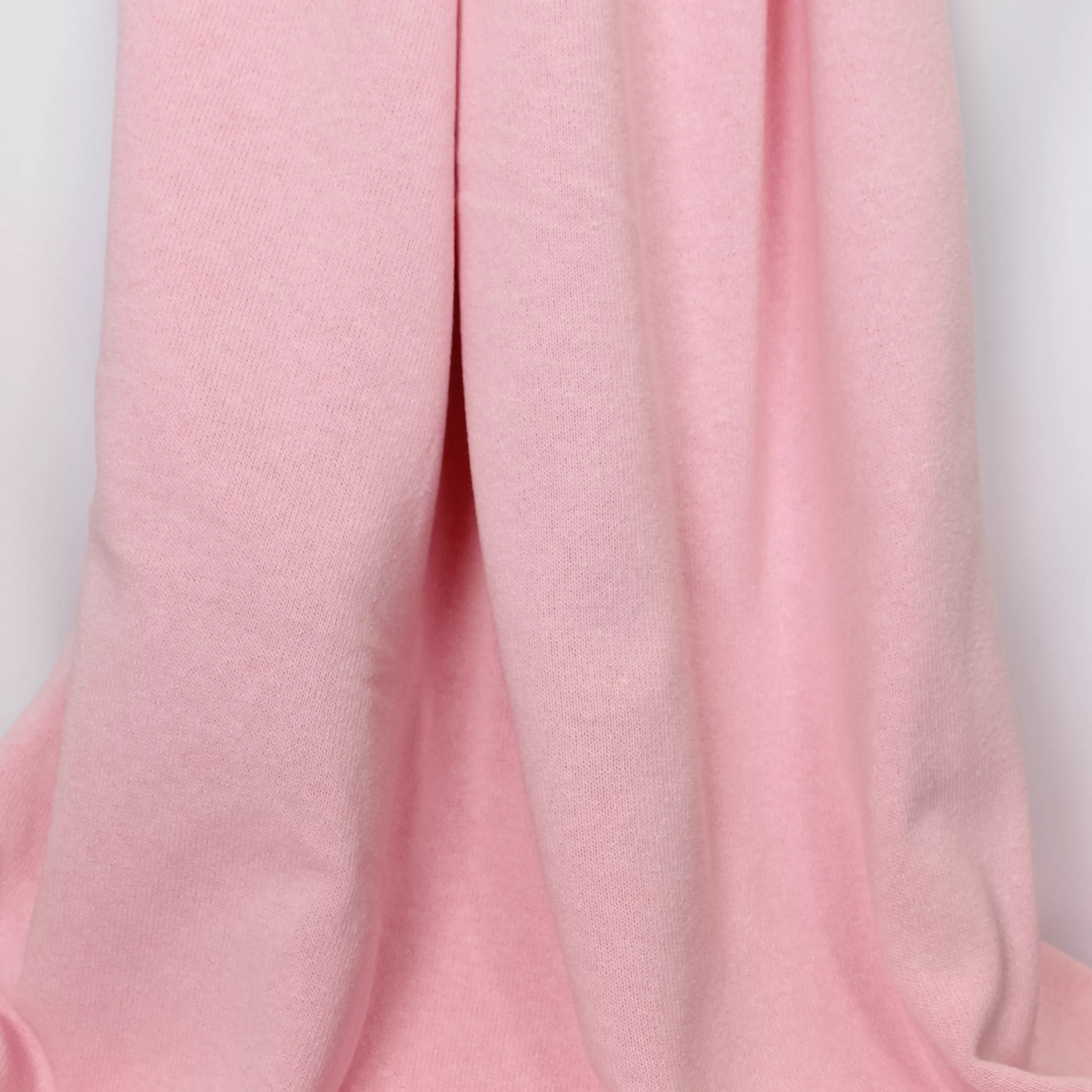 Roze fijne breistof met gebrushte achterkant