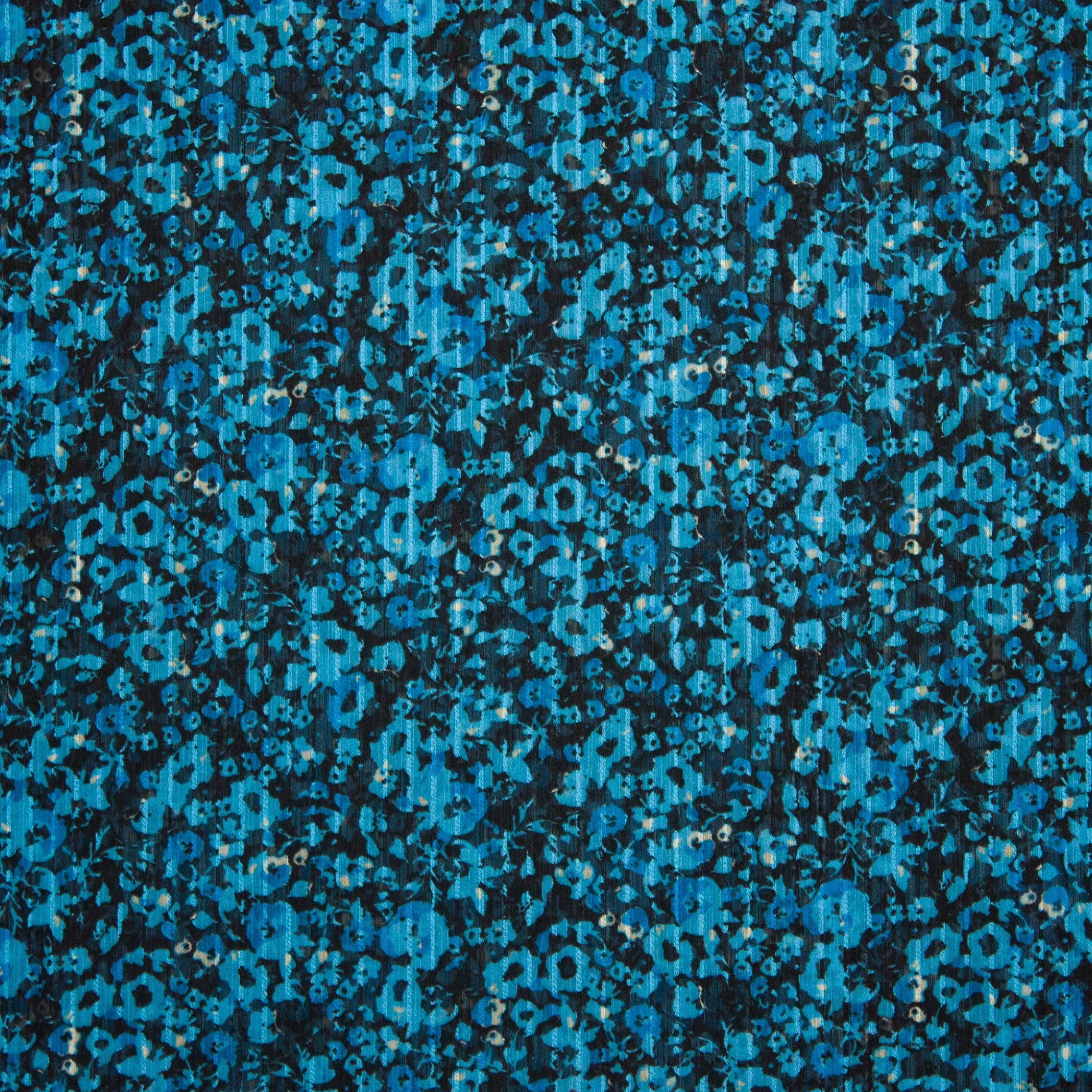 Voile polyester blauw met bloemen