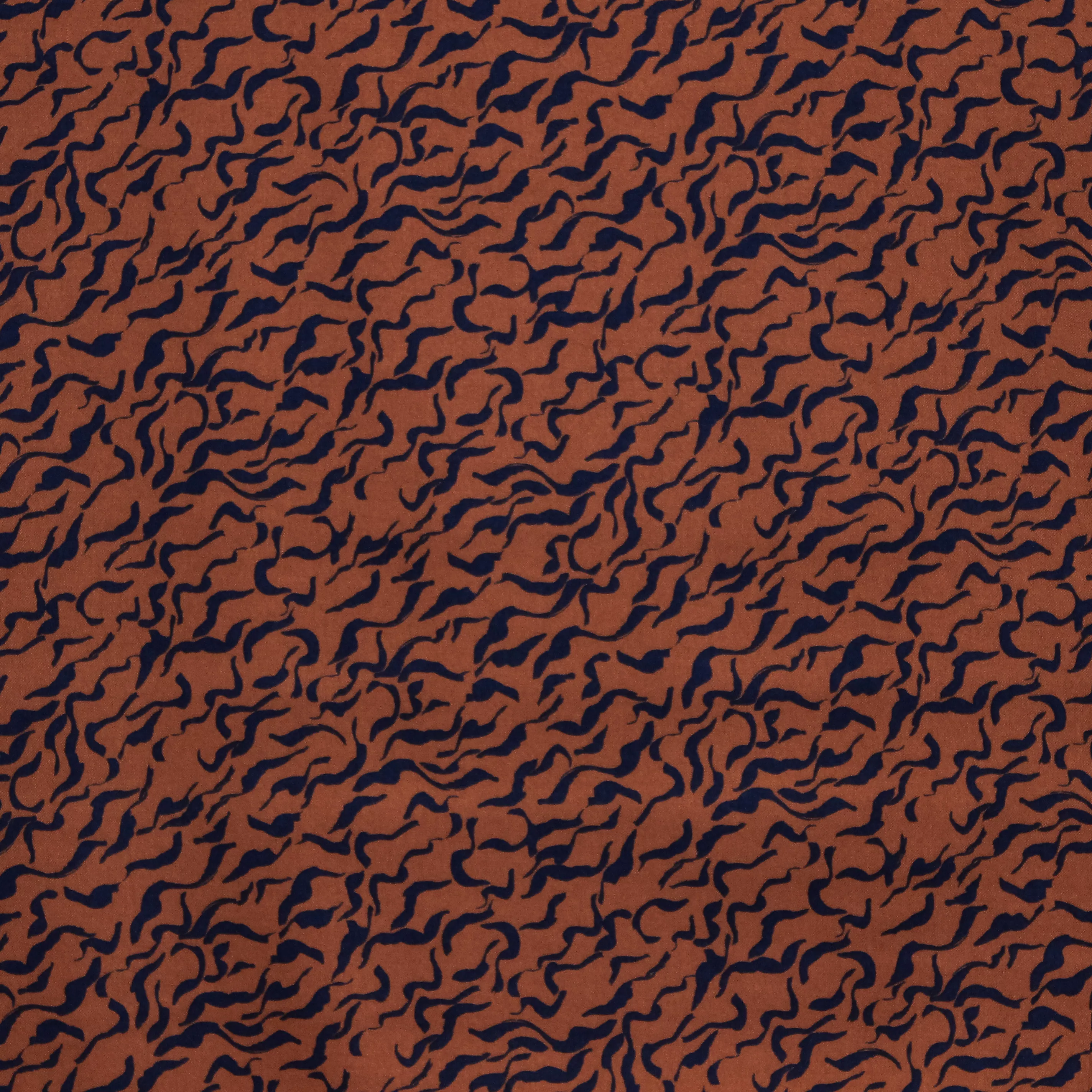 Bruine viscose stretch met zwarte krullen