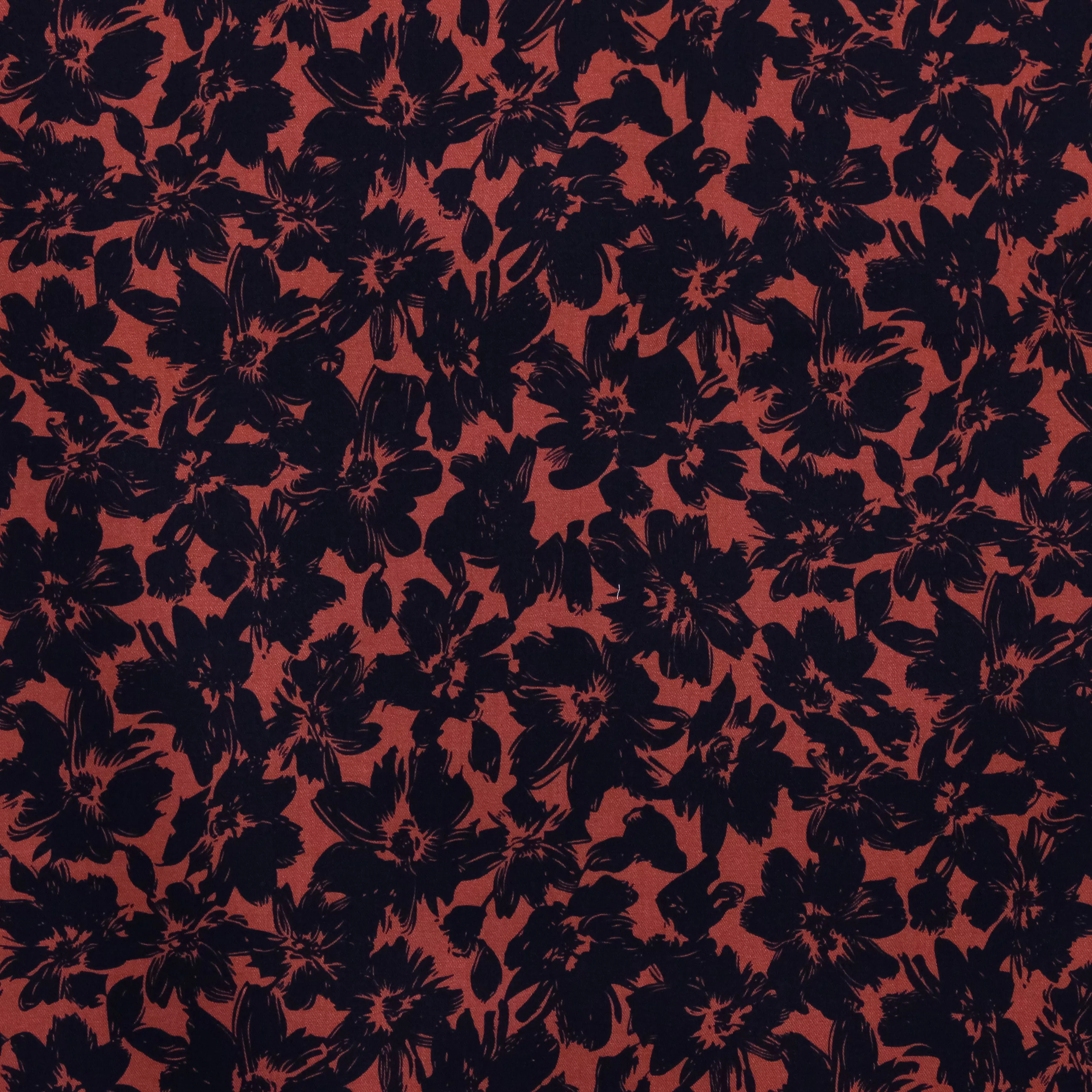 Viscose twill oranjerood met zwarte bloemen