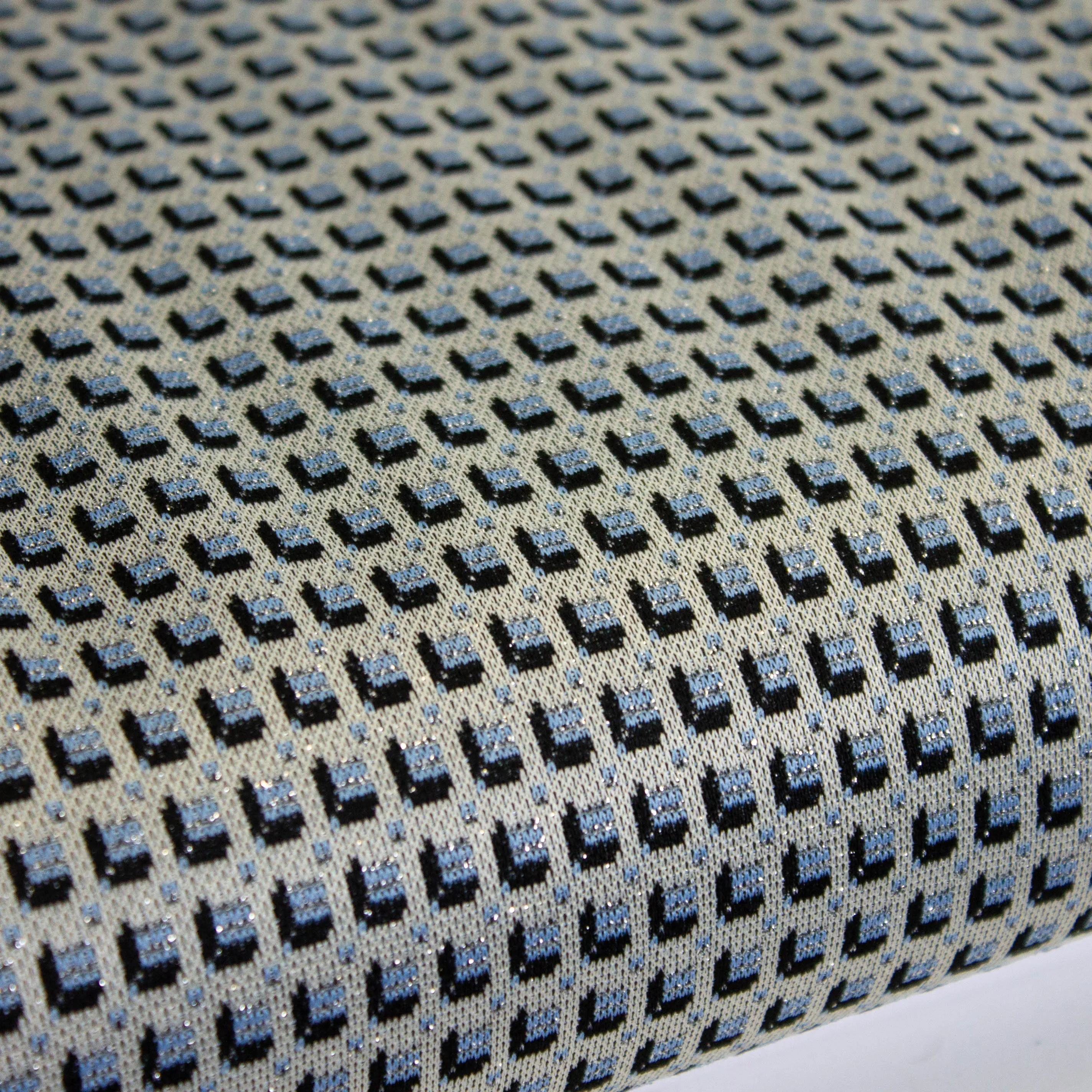 Tricot jacquard blauw blokjes met glinstering