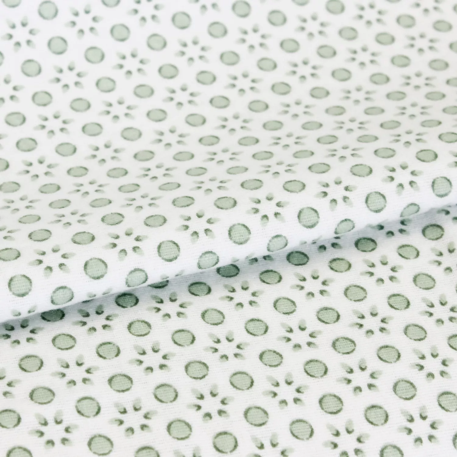 Lakenstof flanel wit met groene motief