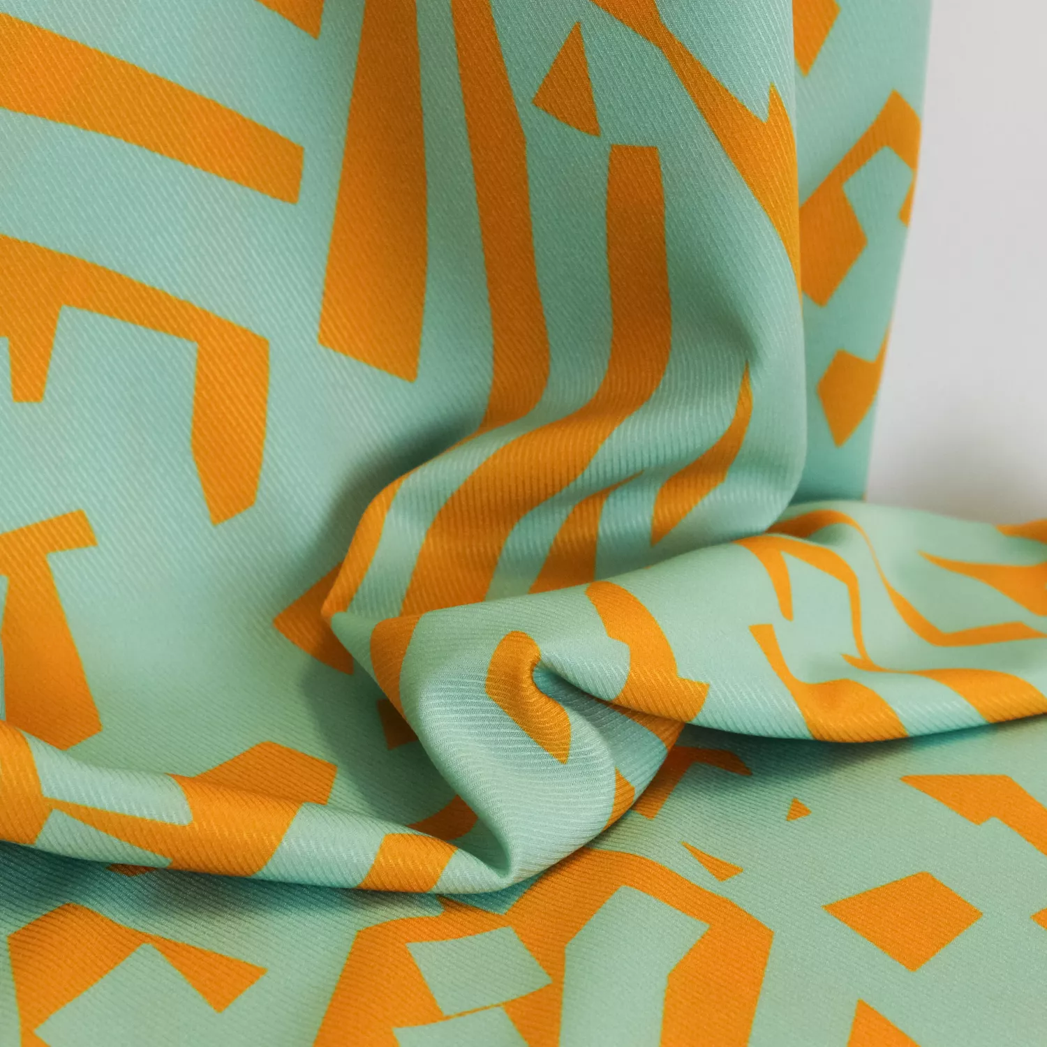 Polyester elasthane turquoise met oker - Burda