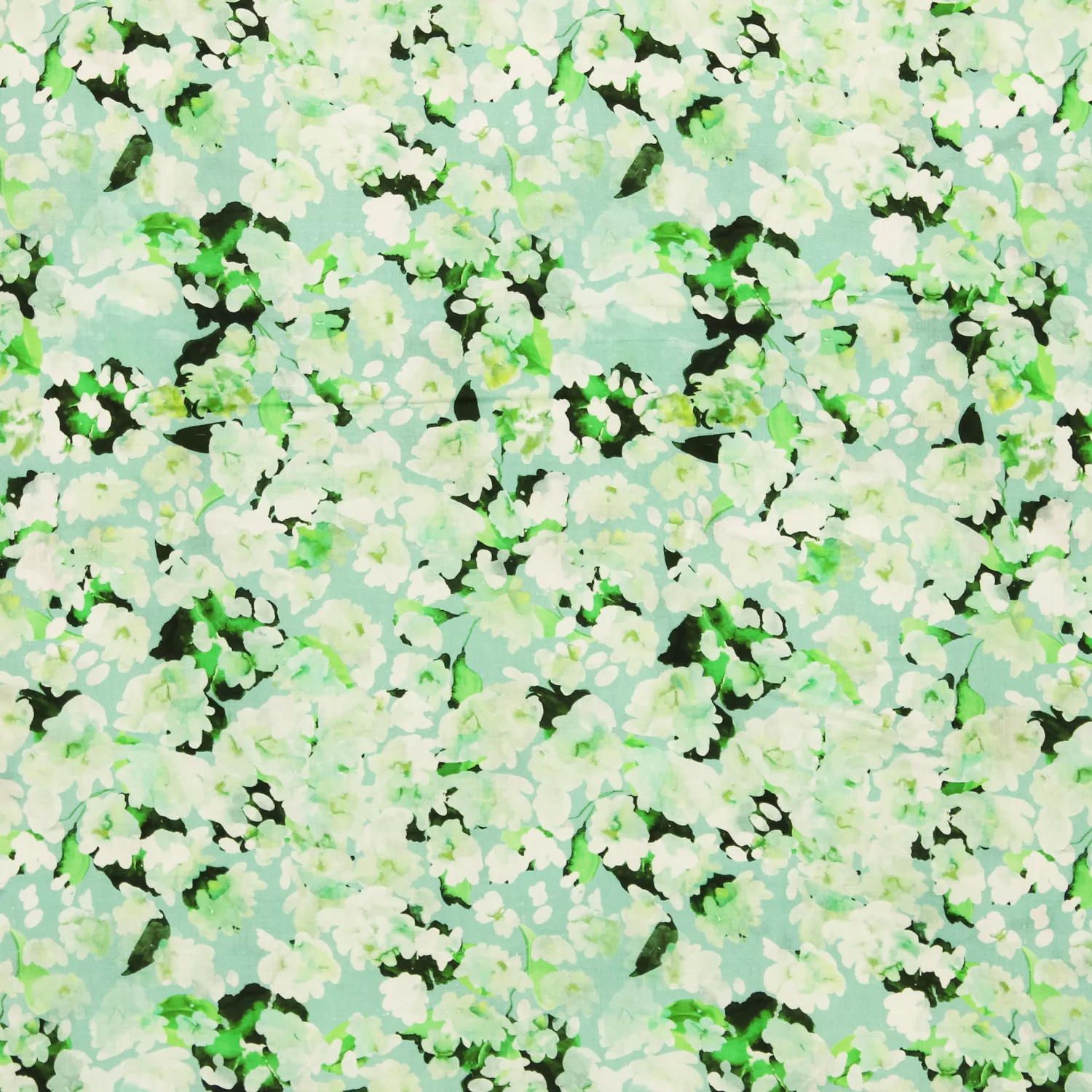 Voile katoen lichtblauw met groene bloemetjes