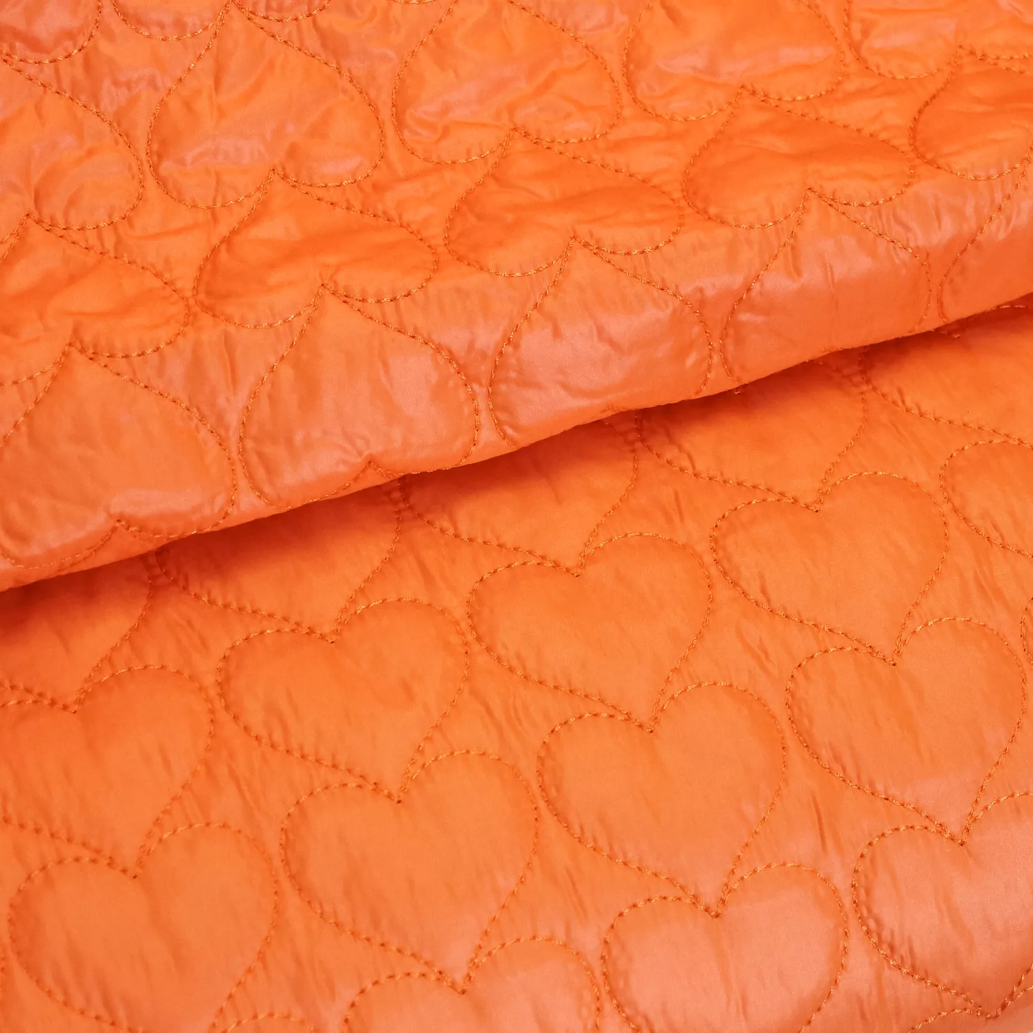 Fijne matelassé neon oranje met hartjes