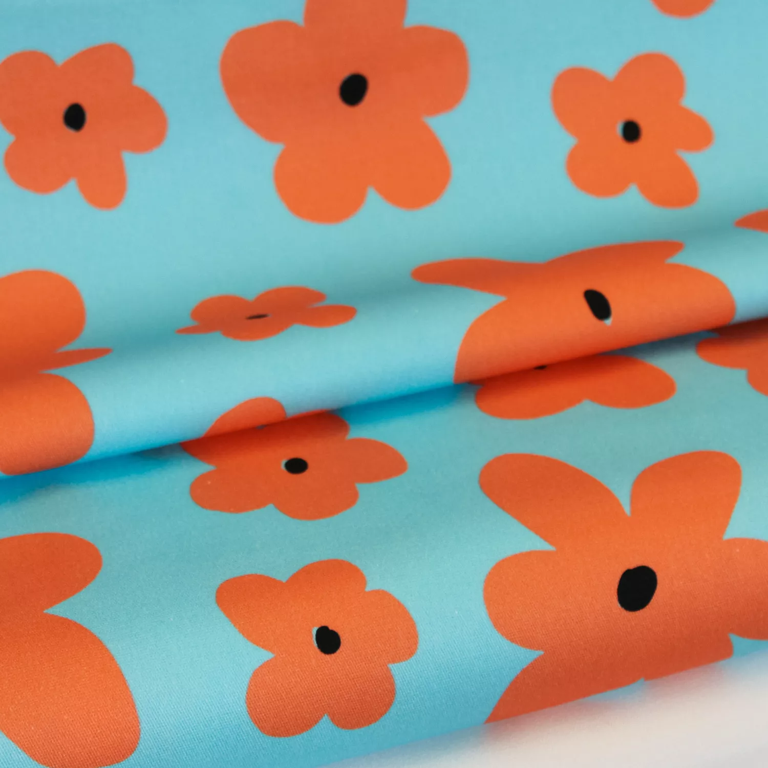 Katoen stretch blauw met oranje bloemen