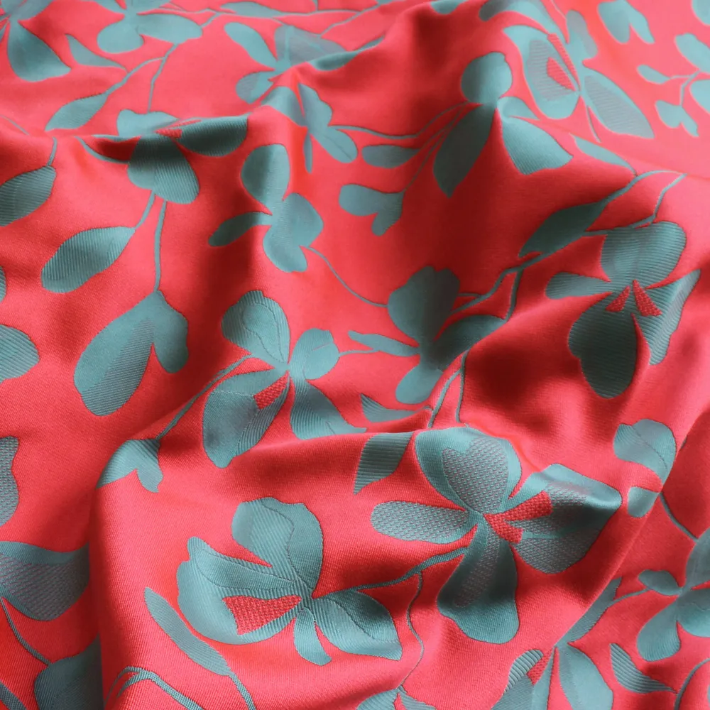 Jacquard mikado double face met bloemen koraalrood/ blauw- Lorré