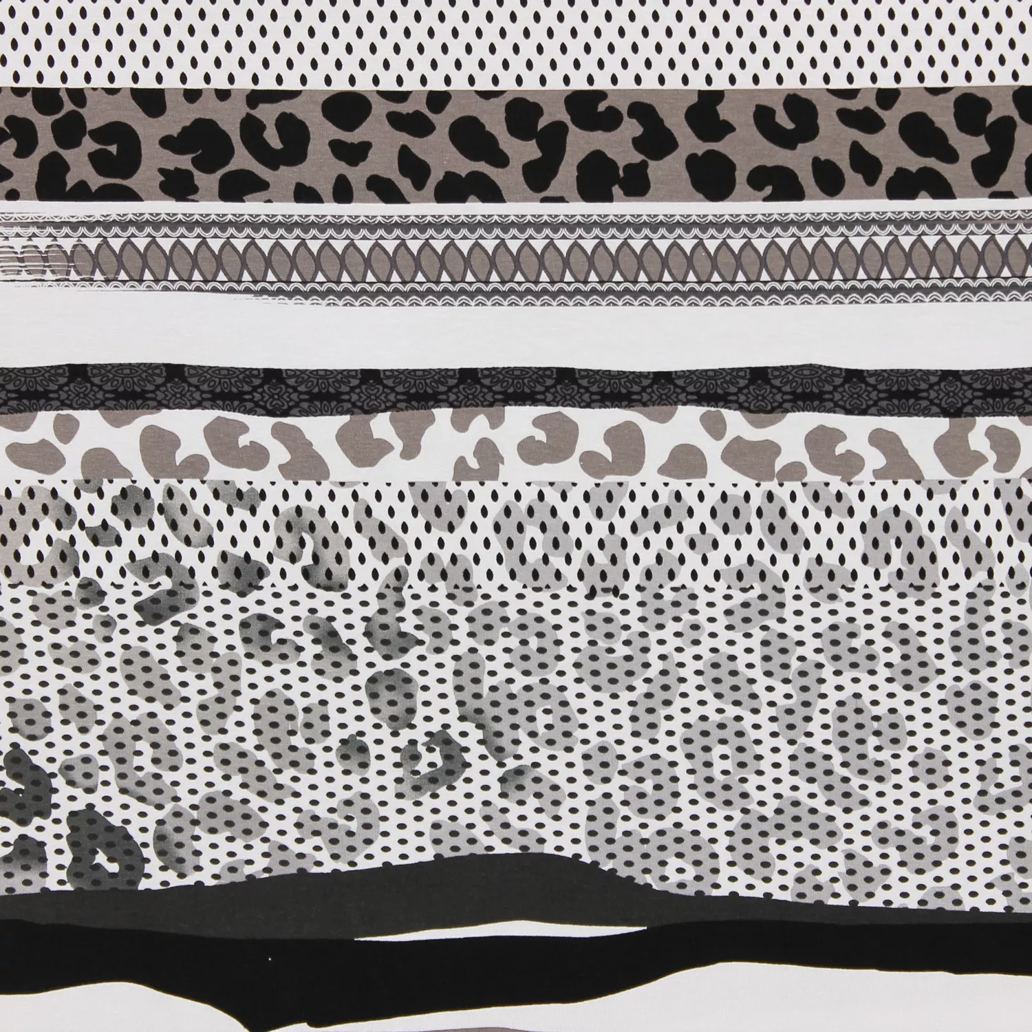 Tricot wit met luipaard/bolletjes patroon
