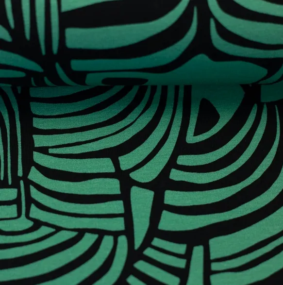 Tricot groen met abstract patroon