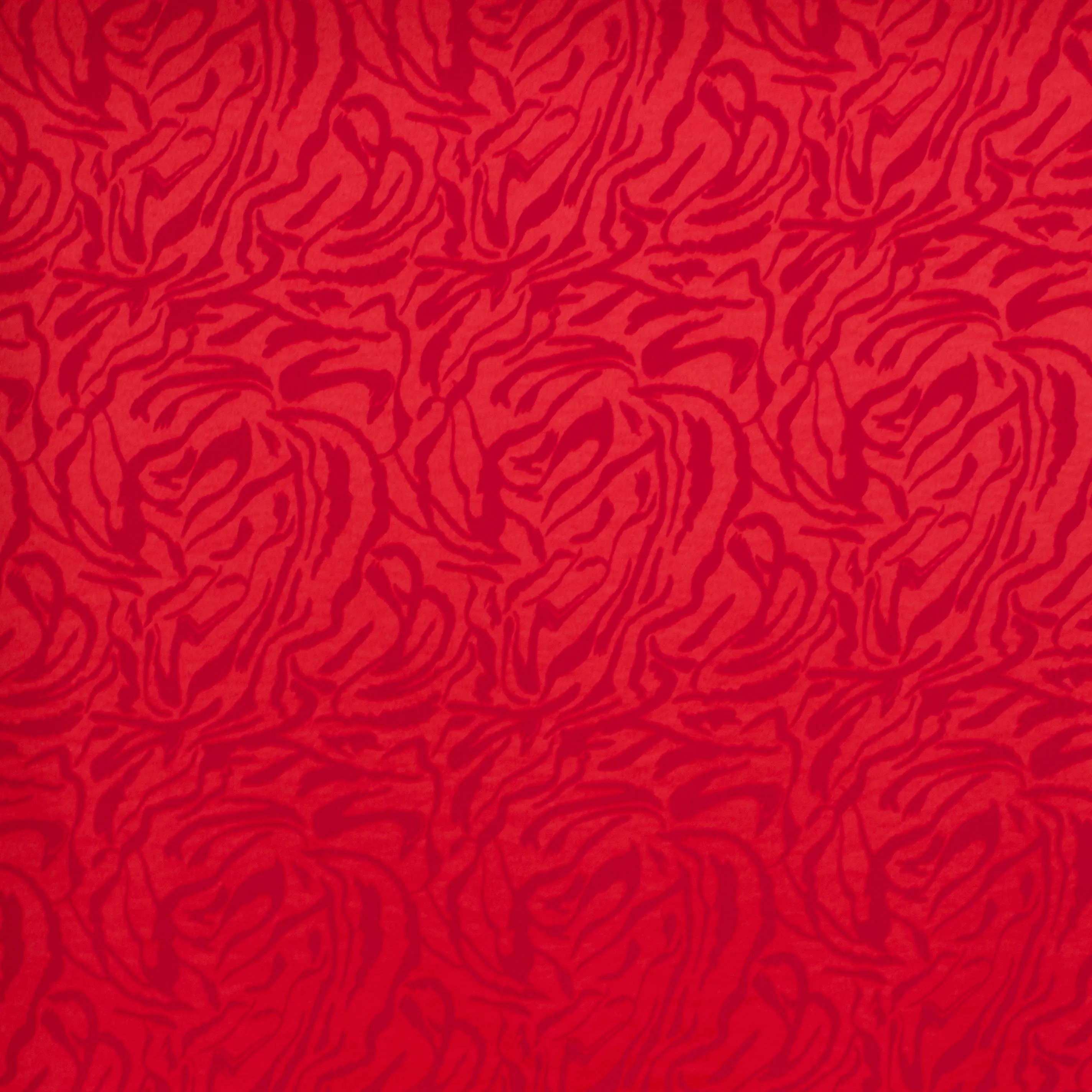 Viscose polyester jacquard gesatineerd rood met dierenprint - Knipmode & Editex