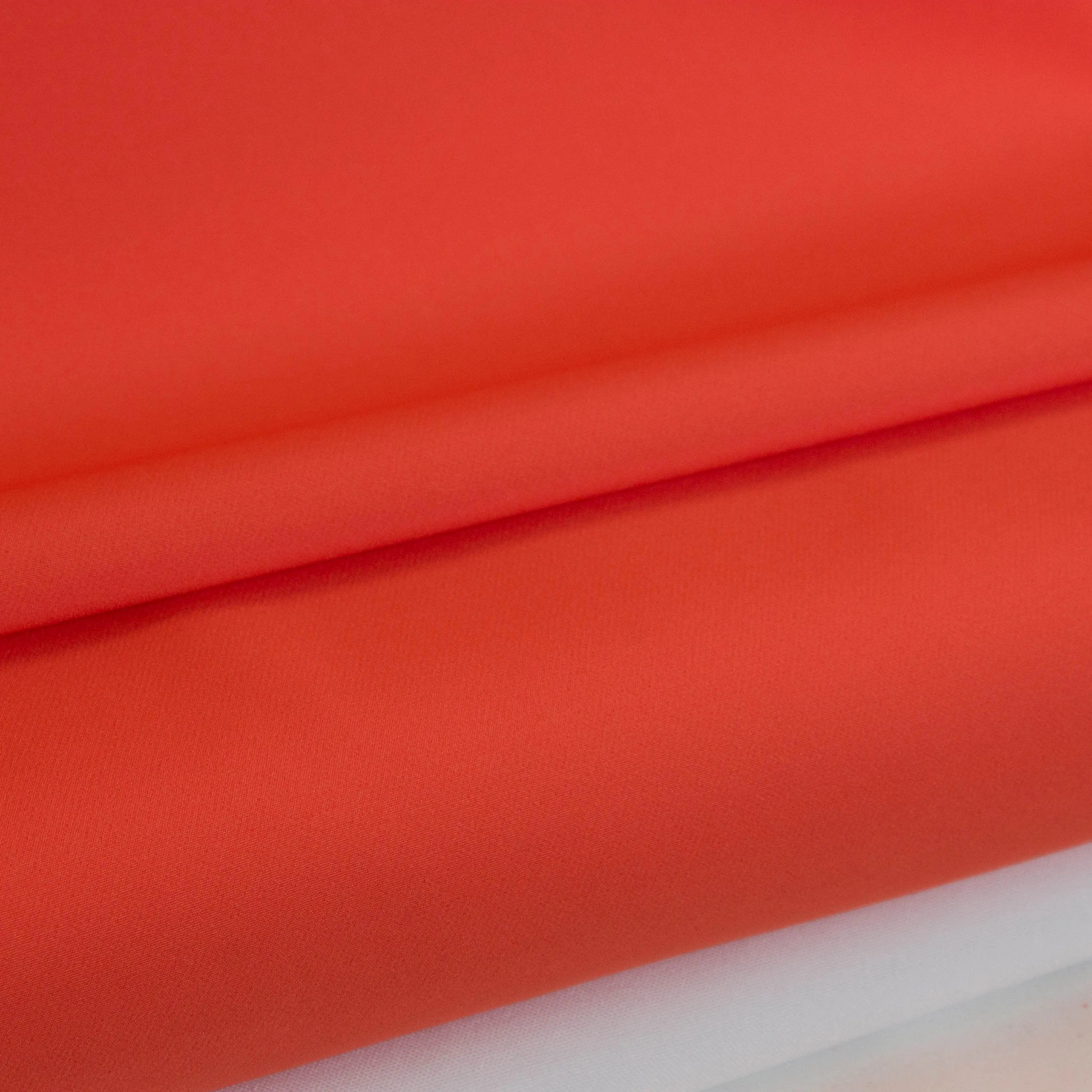 Polyester tricot oranje- A La Ville