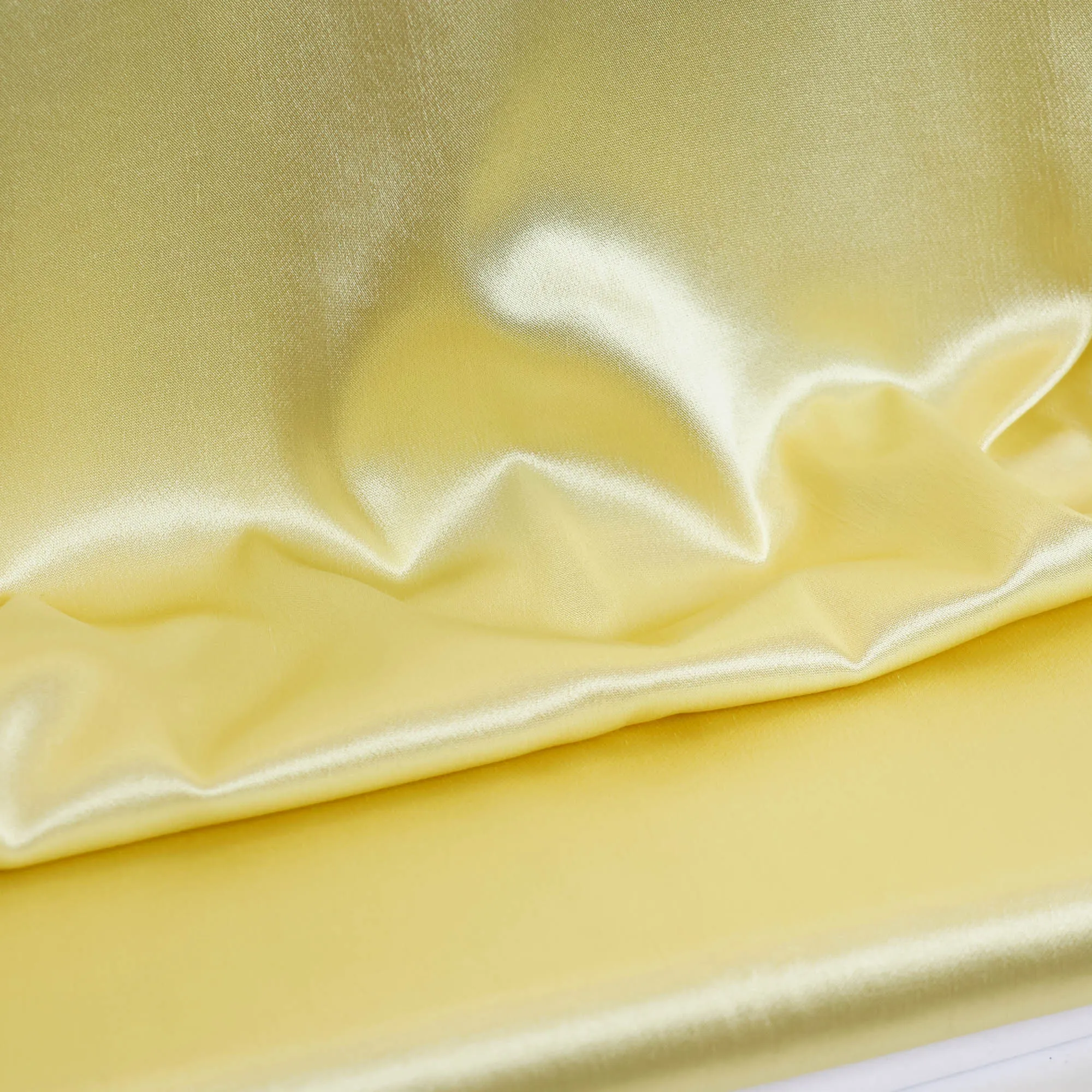 Viscose satijn stretch goudgeel