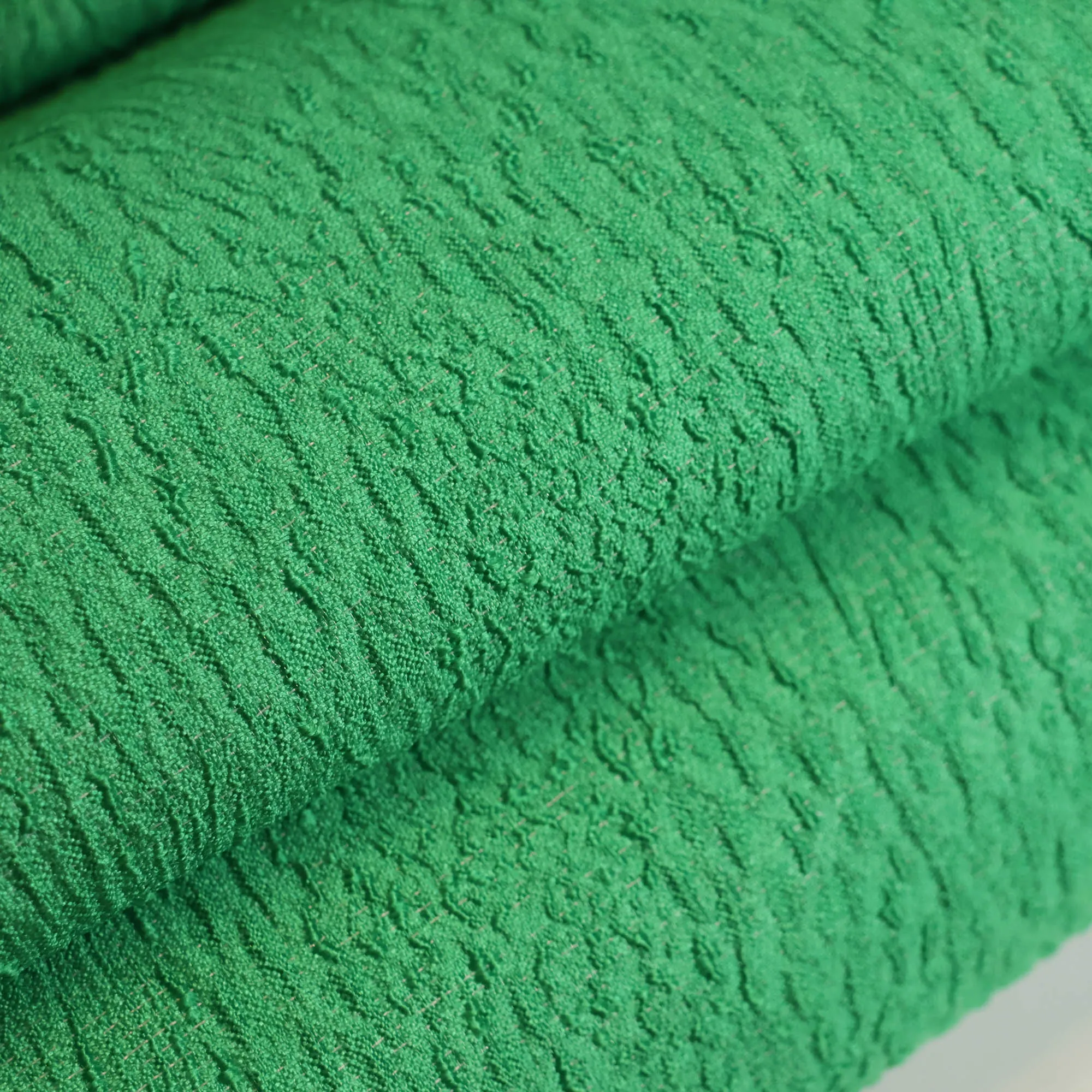 Reliëfstof groen met glans