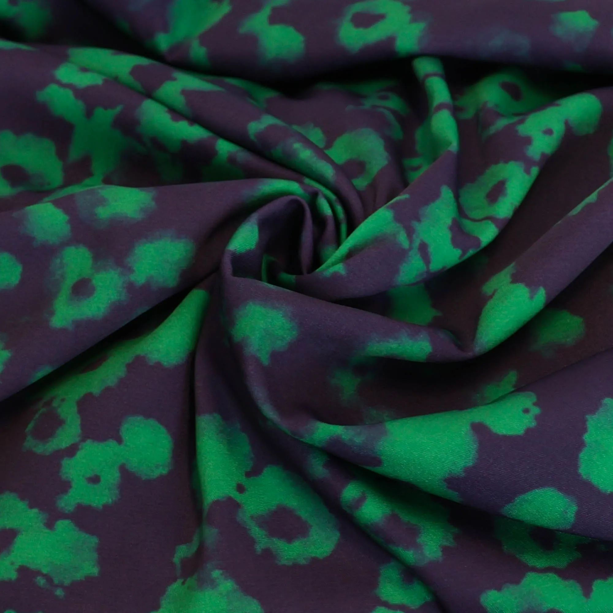 Stretch polyester paars met groene vlekken - A La Ville