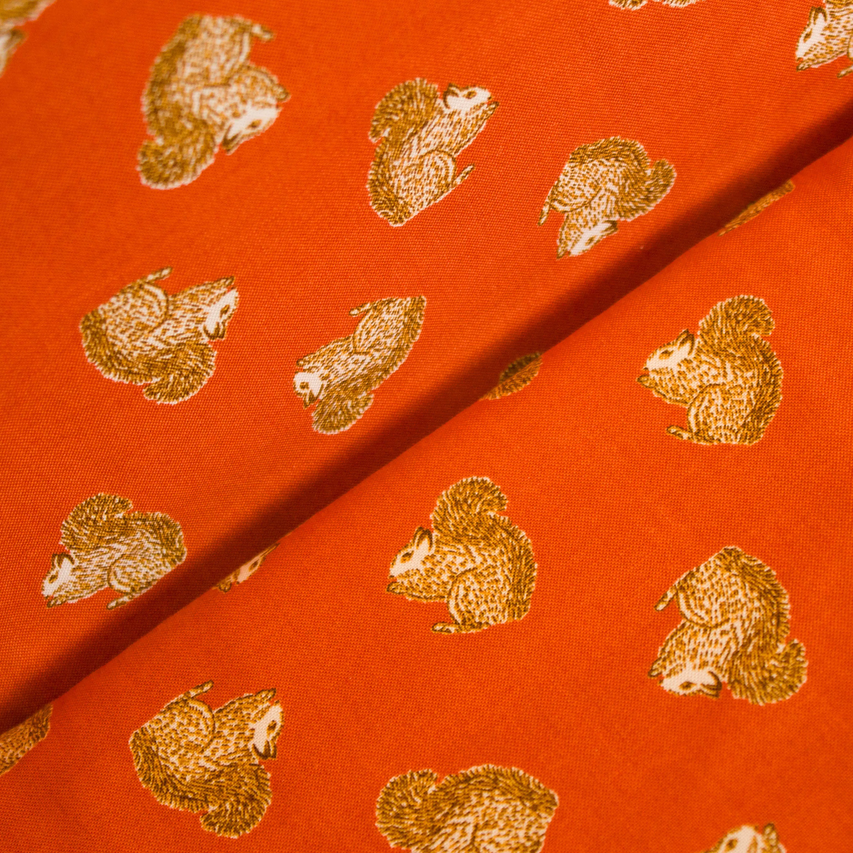 Katoen roest/oranje met eekhoorns