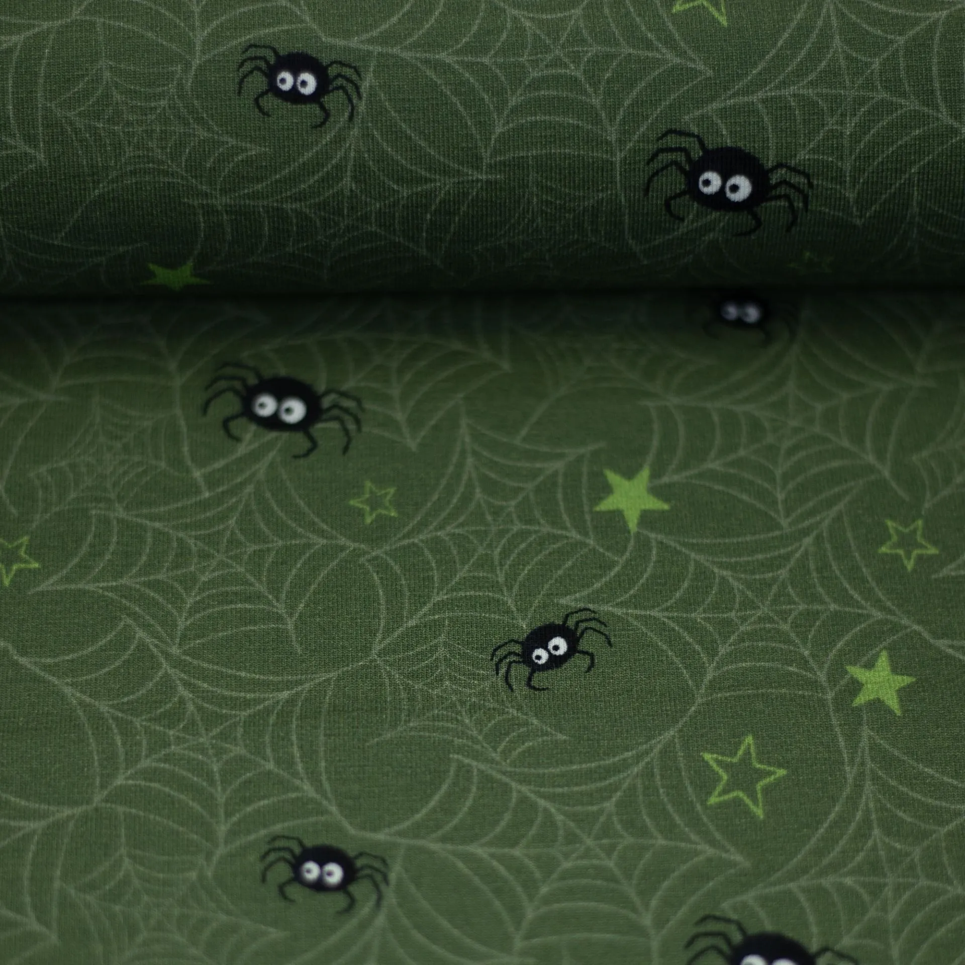 Katoen tricot groen met groen met spinnen