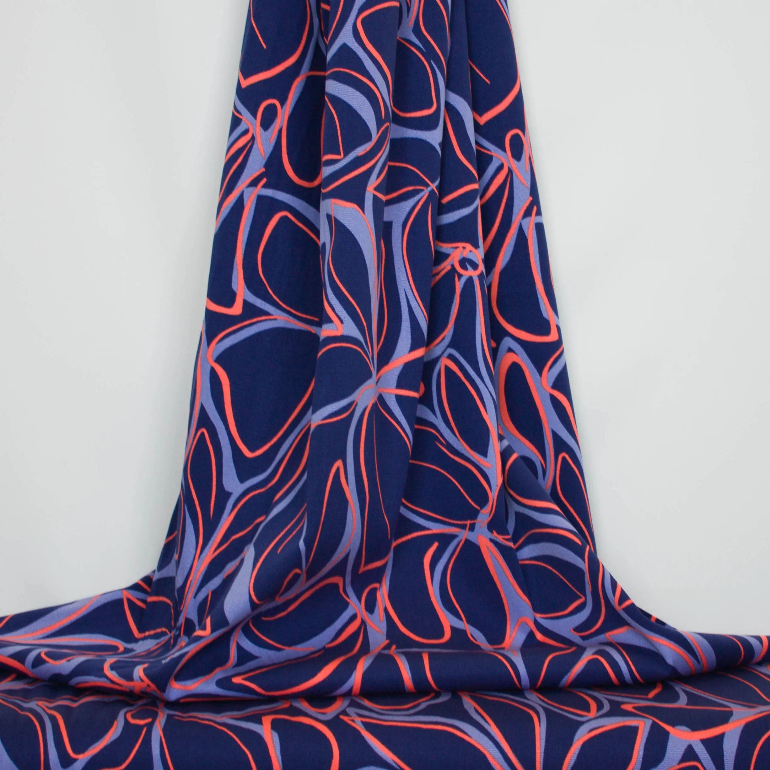 Viscose licht elastisch blauw met oranje bloemen