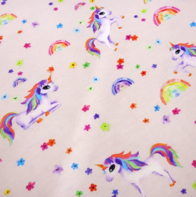 Tricot lichtroze met eenhoorns en regenbogen