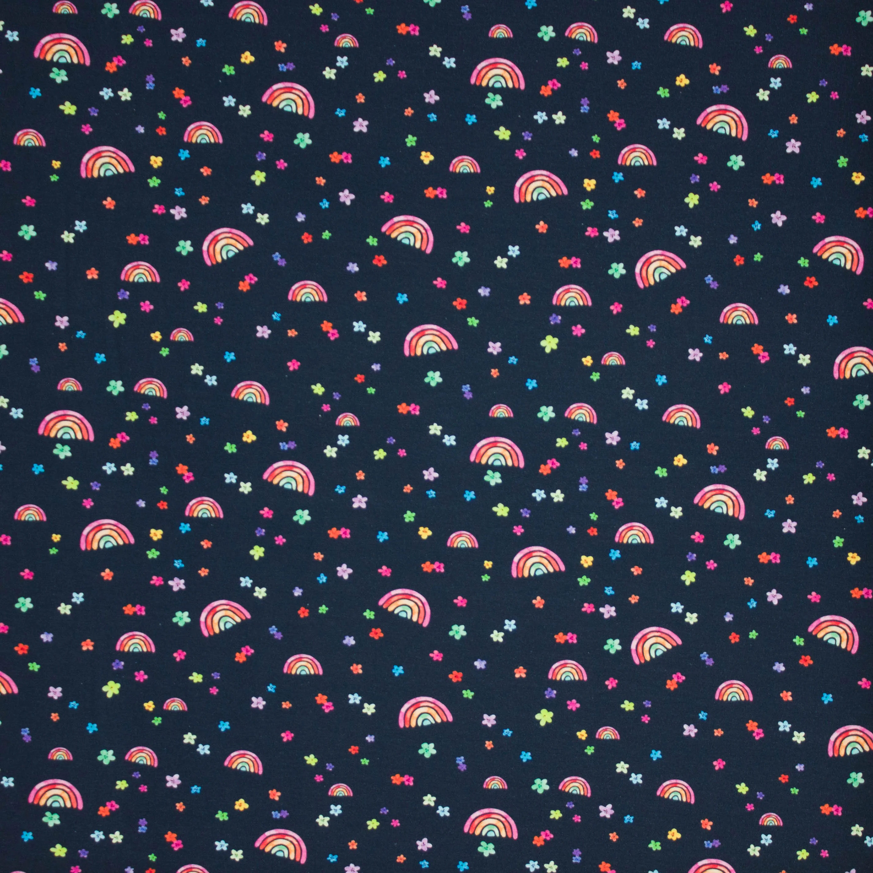 Tricot donkerblauw met regenboogjes en bloemetjes