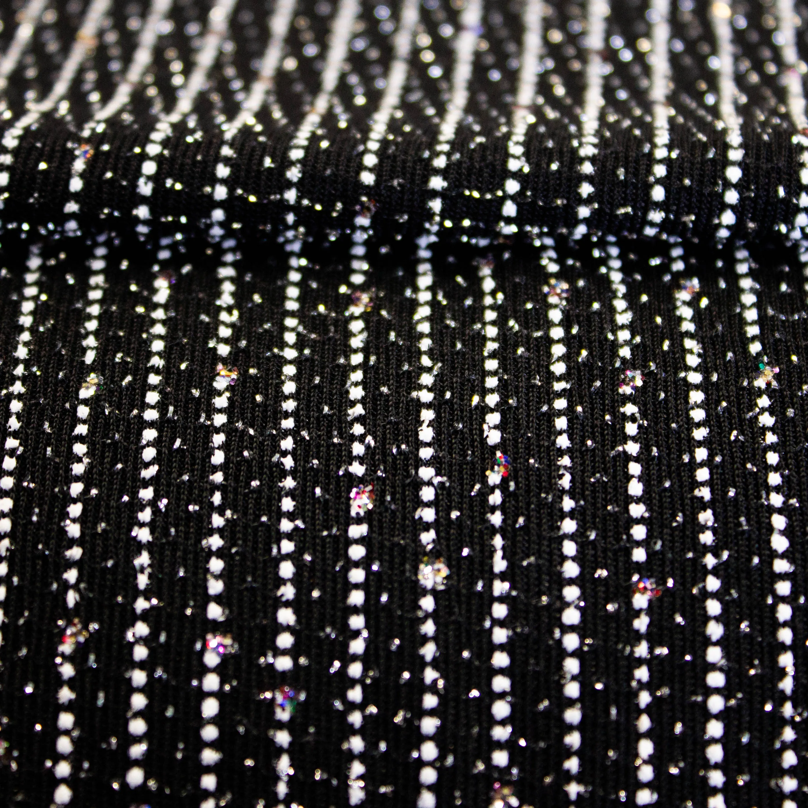 Glitter tricot licht vallend zwart