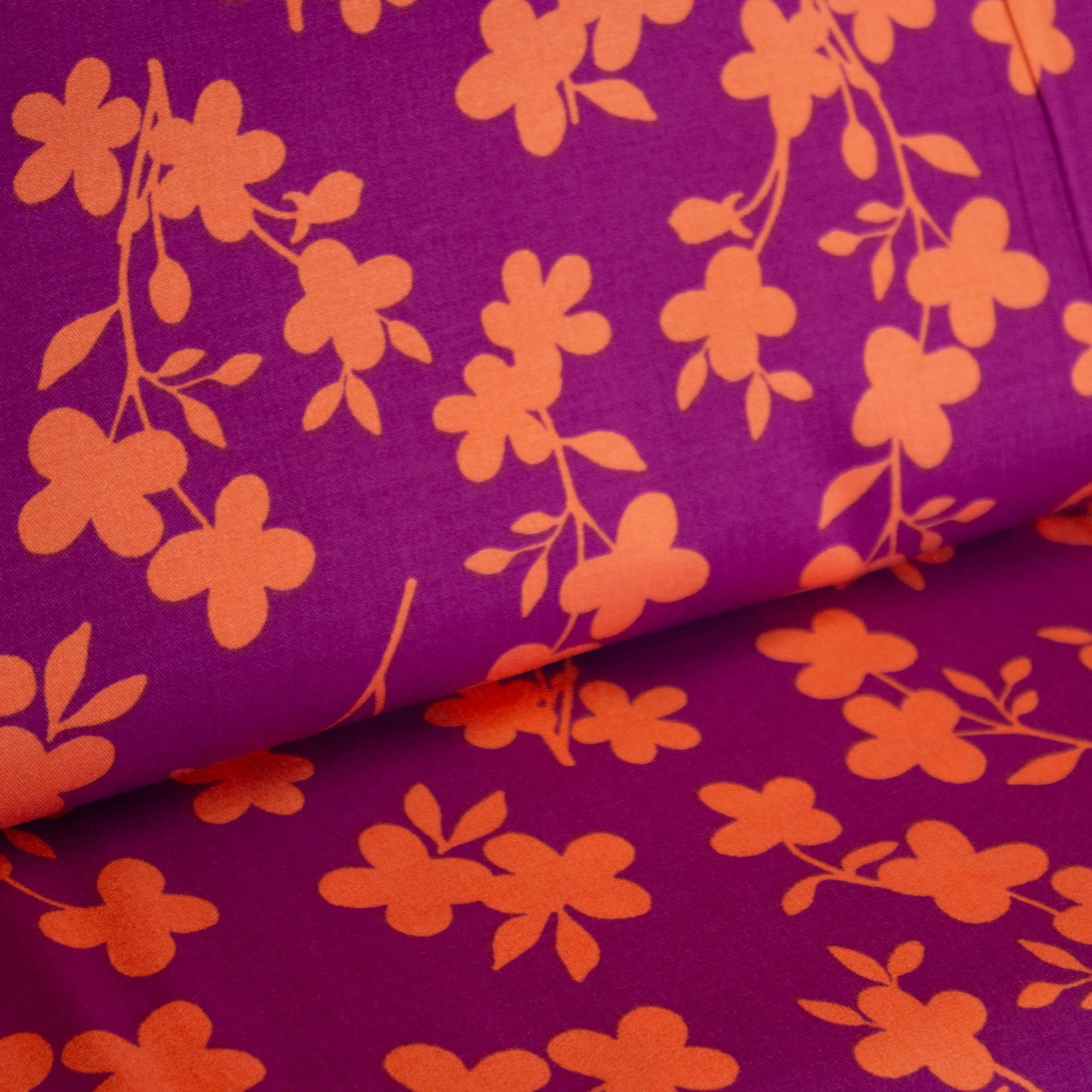 Viscose stretch paars met oranje bloemen