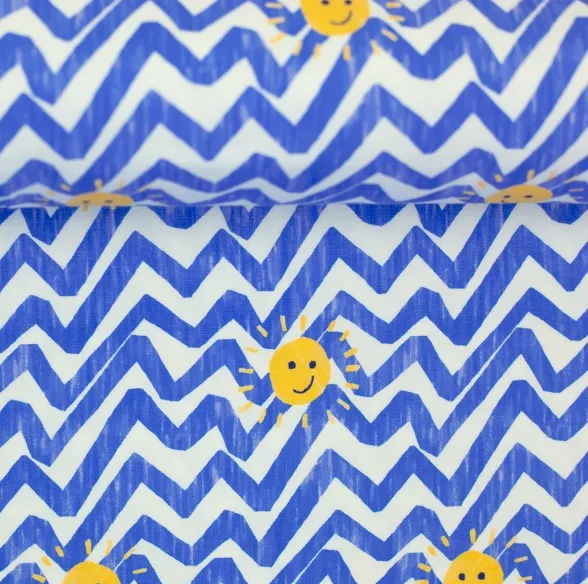 Tricot wit/blauw met zonnetjes