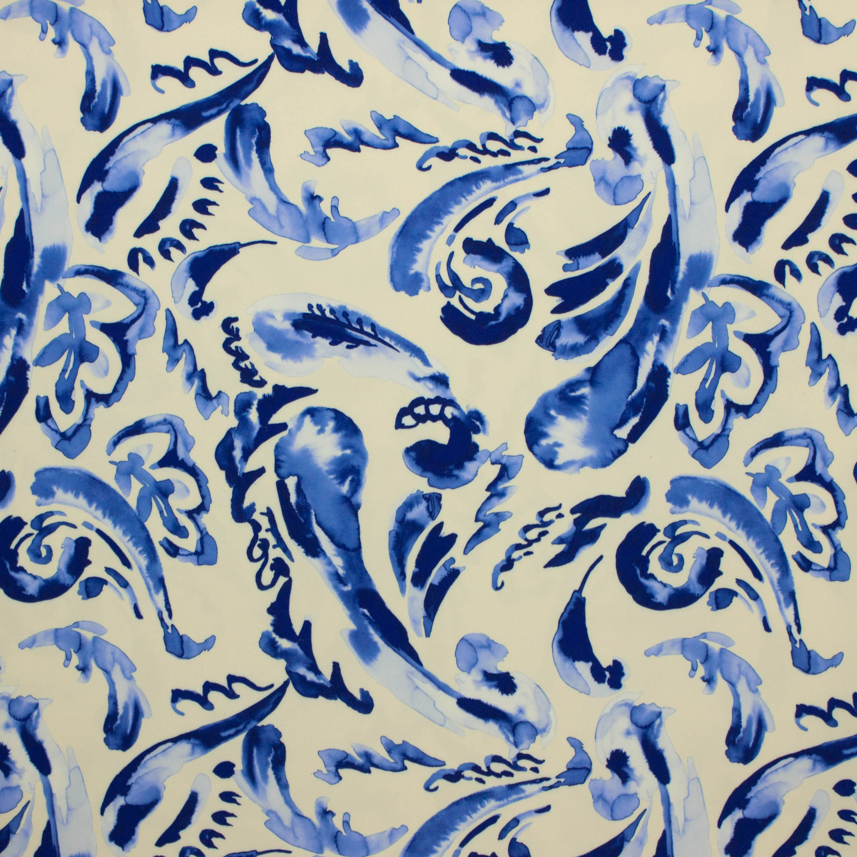 Polyester tricot beige met blauwe print