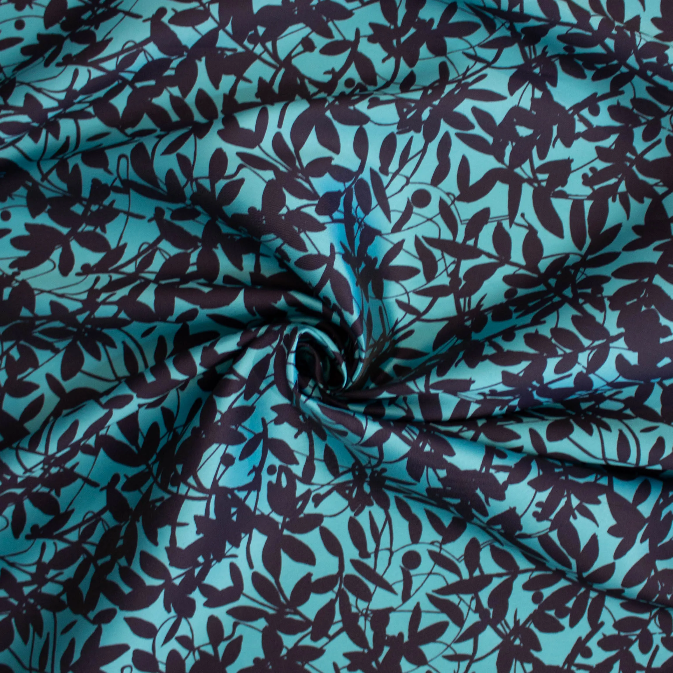 Zijde polyester turquoise met plantenpatroon - Lorré
