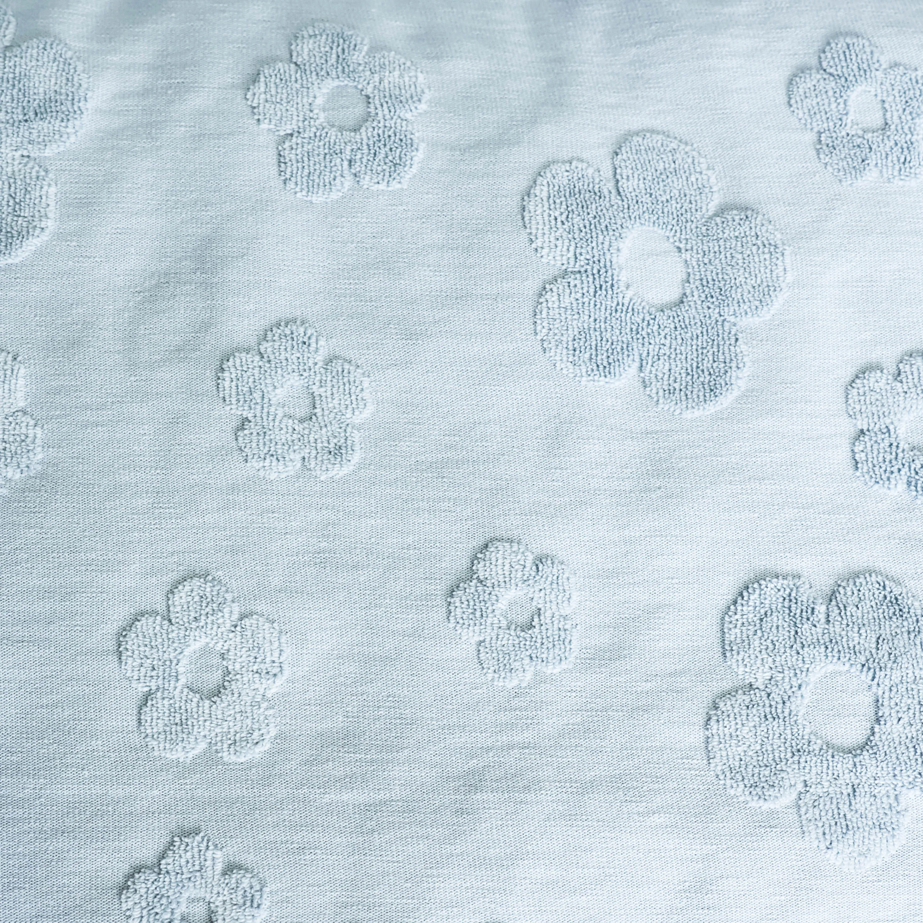 Jacquard licht blauw met bloemen