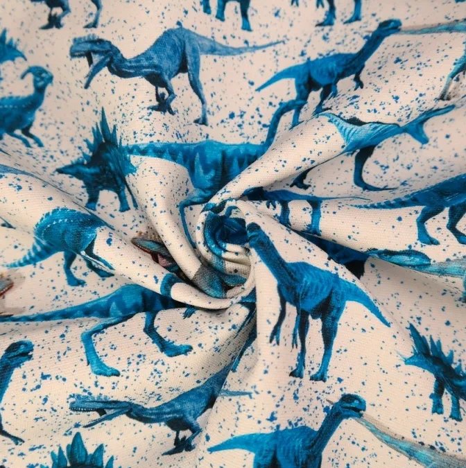 Tricot wit met blauwe dino's