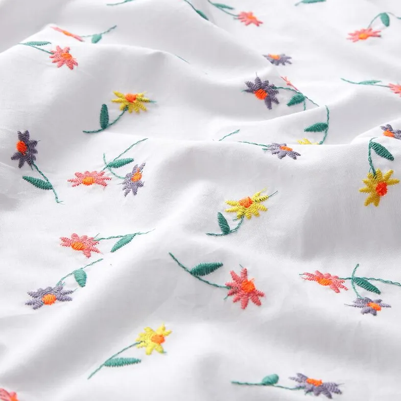 Broderie voile wit met fluo bloemetjes