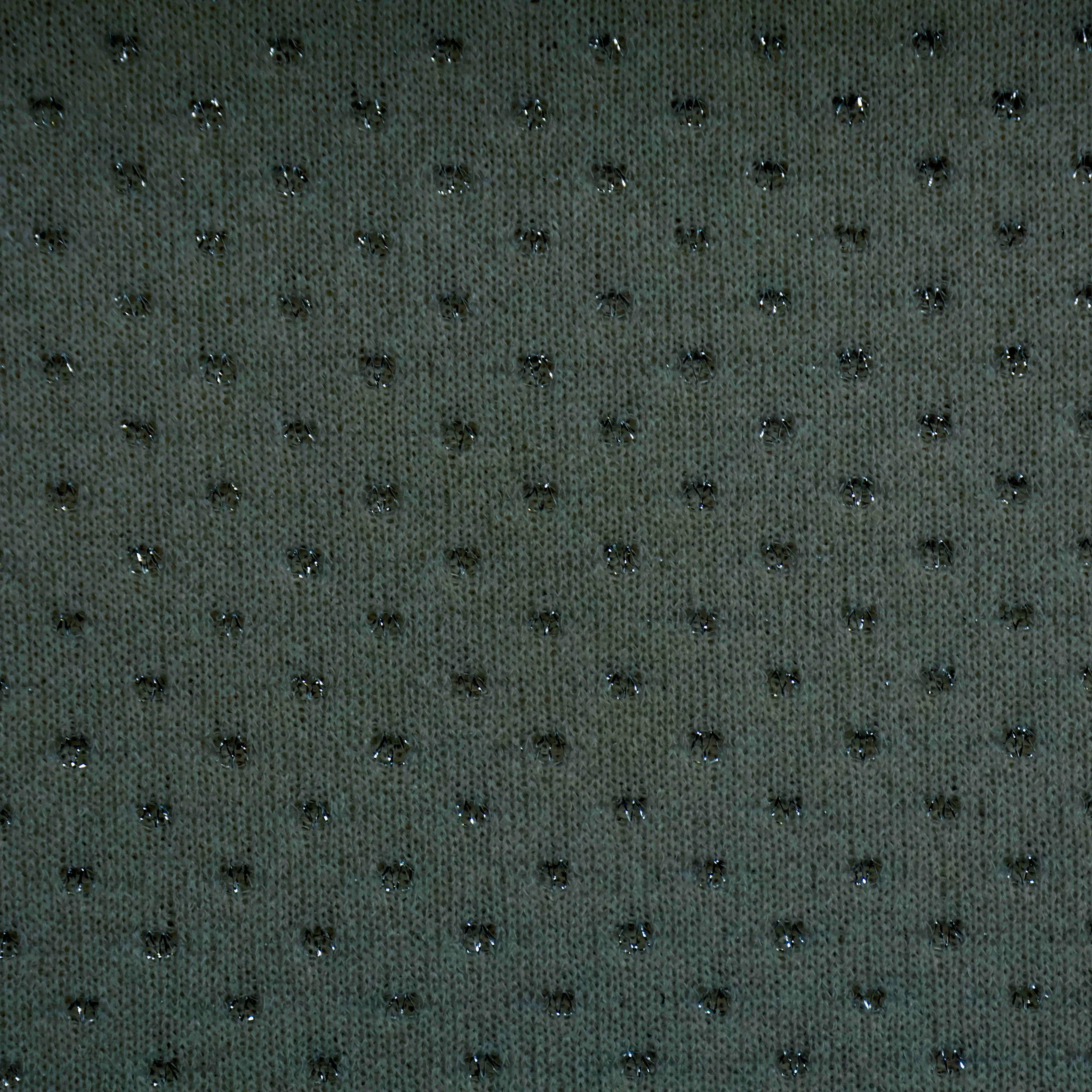 Brei donkergrijs met groene tint en glinsterende bolletjes