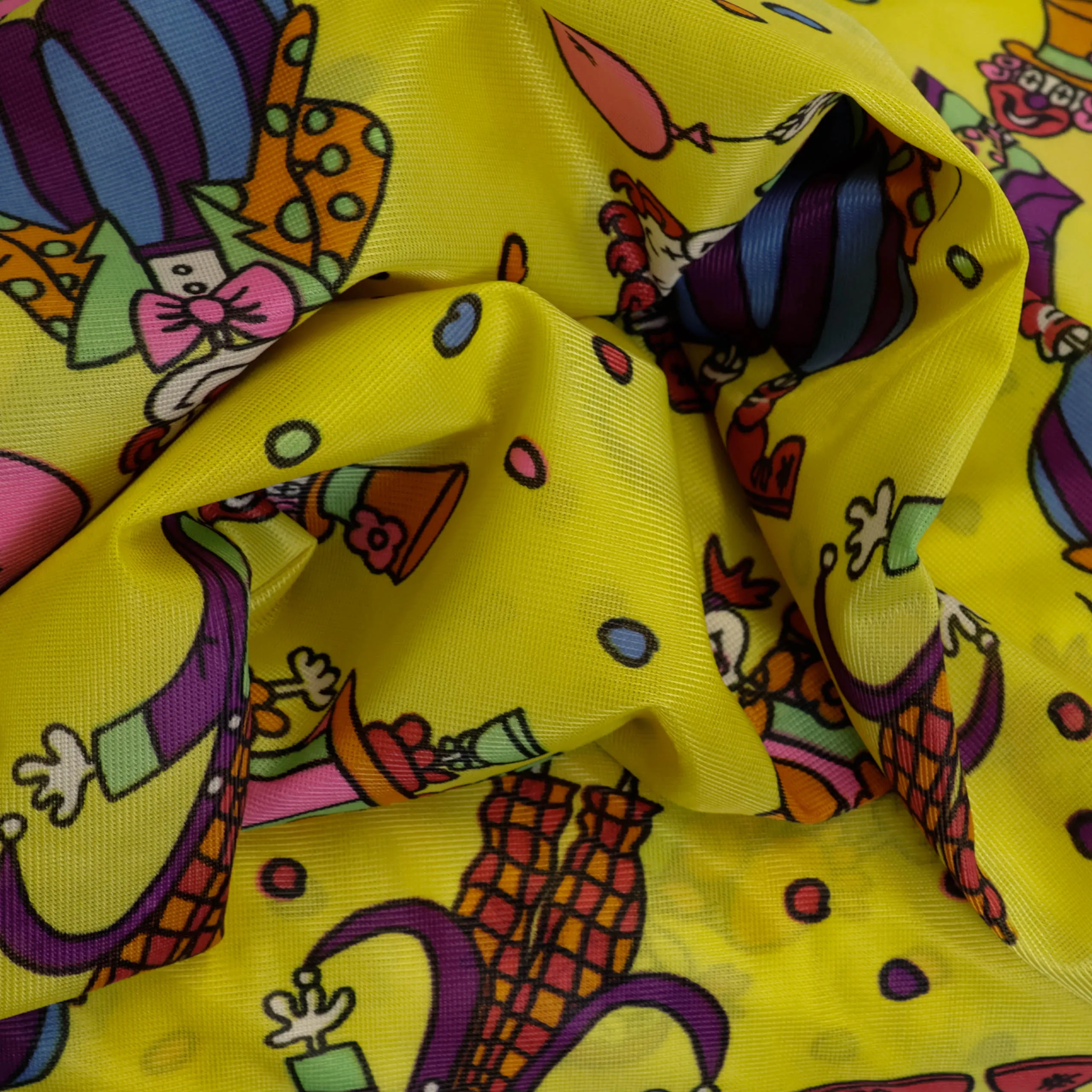 Polyester geel met clownpatroon