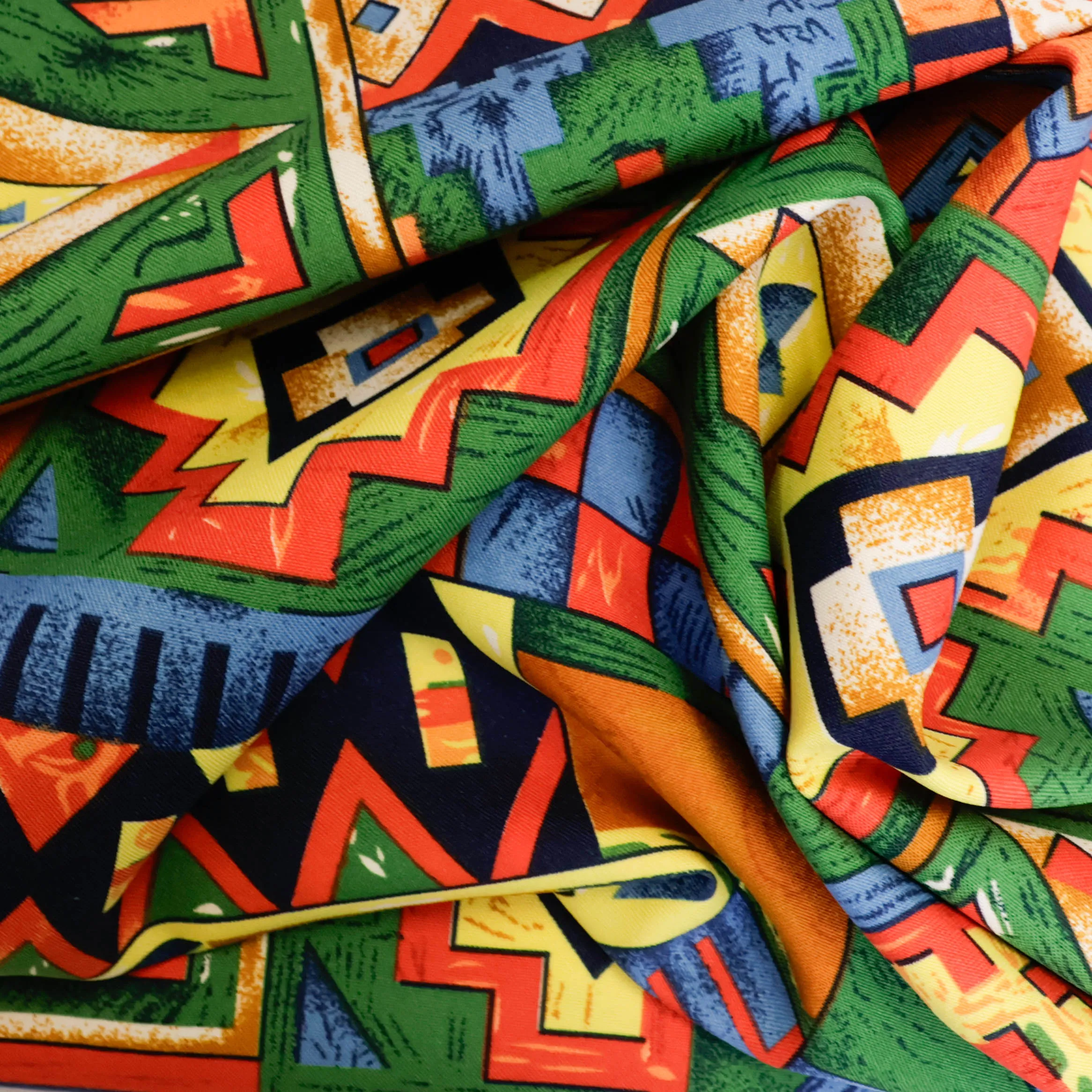 Polyester multicolor met grafische vlakken