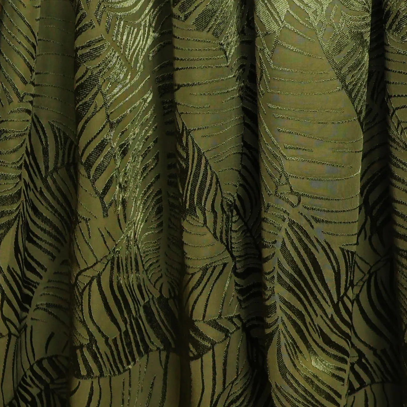 Viscose jacquard kaki met bladermotief