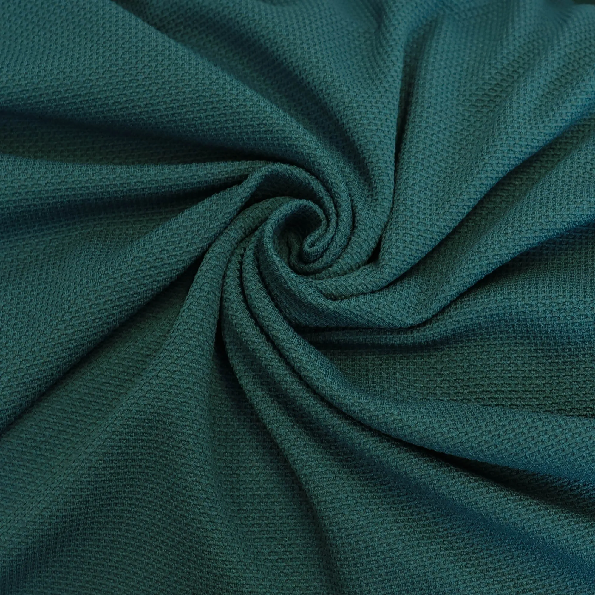 Stretch structuur tricot petrol