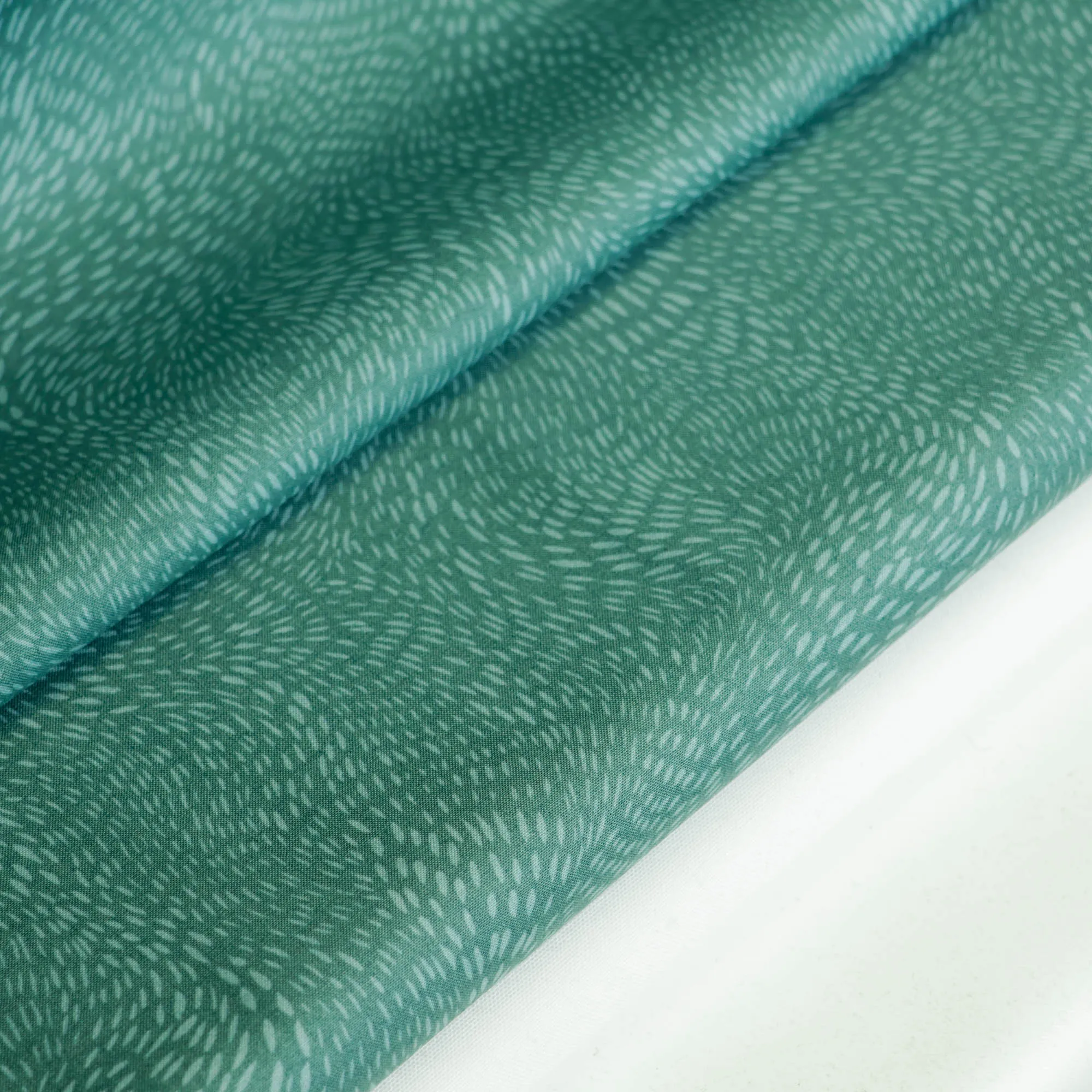 Katoen donker groenblauw met patroon